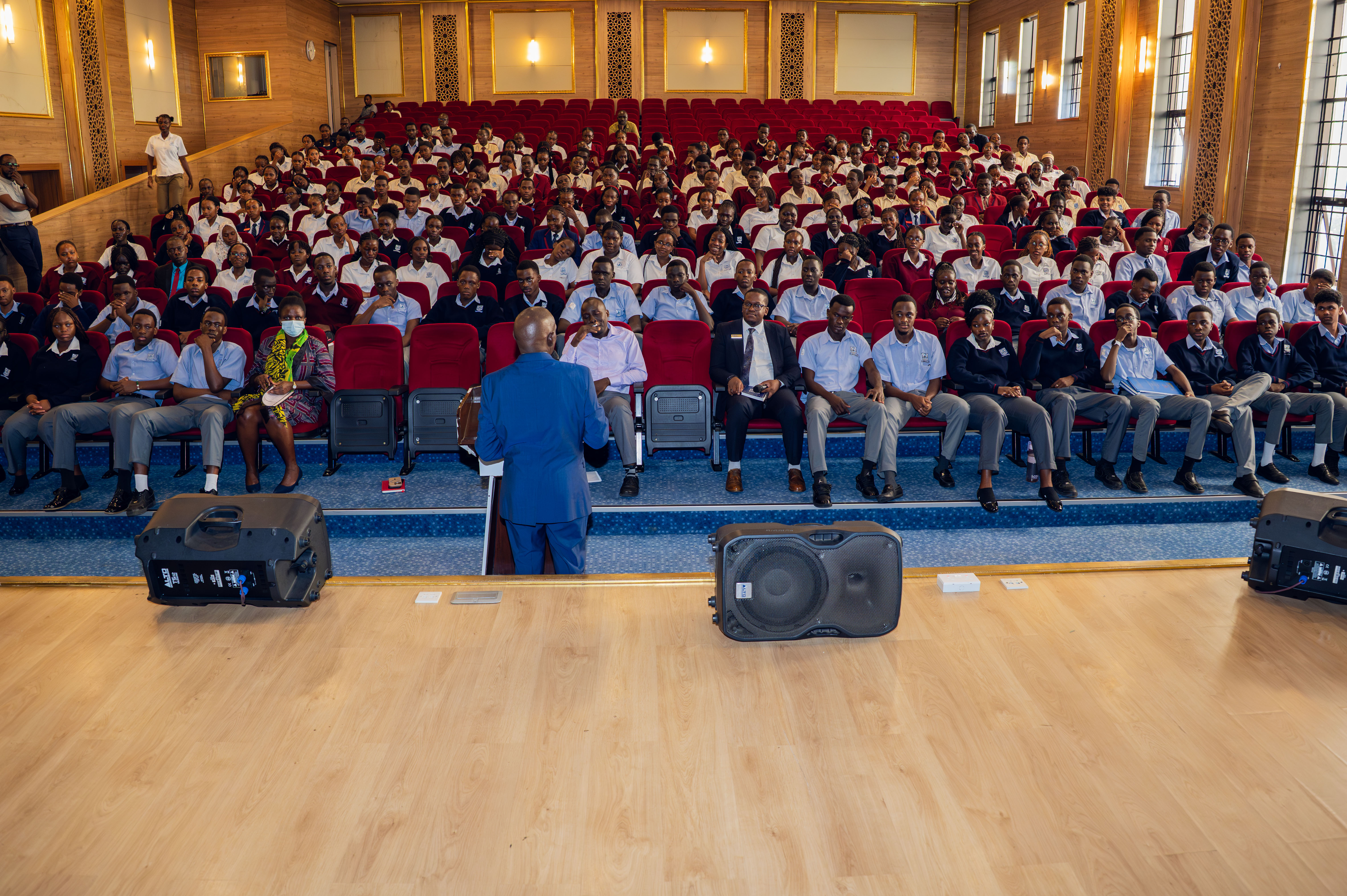 A school building stands against the backdrop of a clear sky