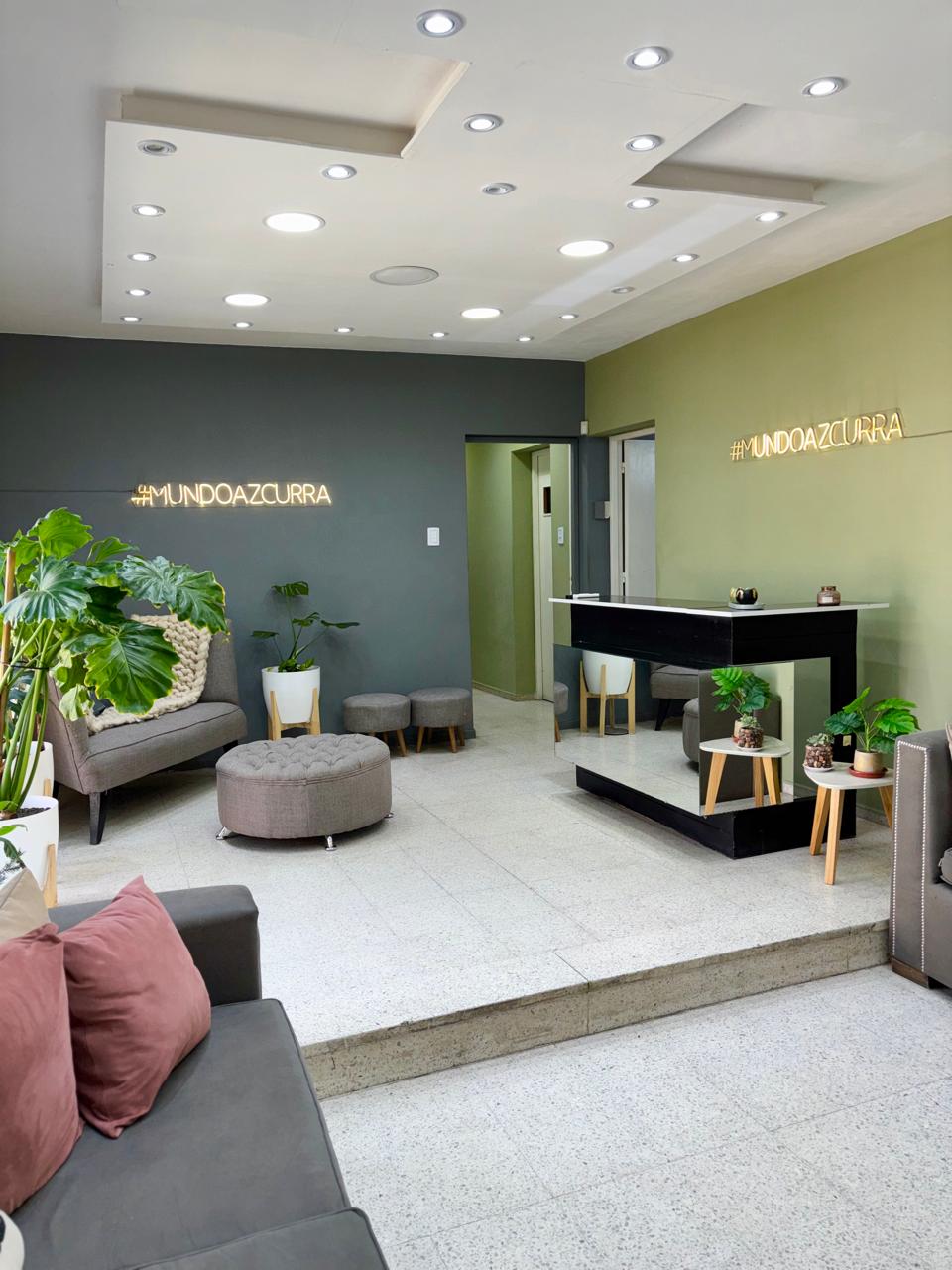 Green dresser, posters to create a pleasant atmosphere in the Camelia beauty salon.