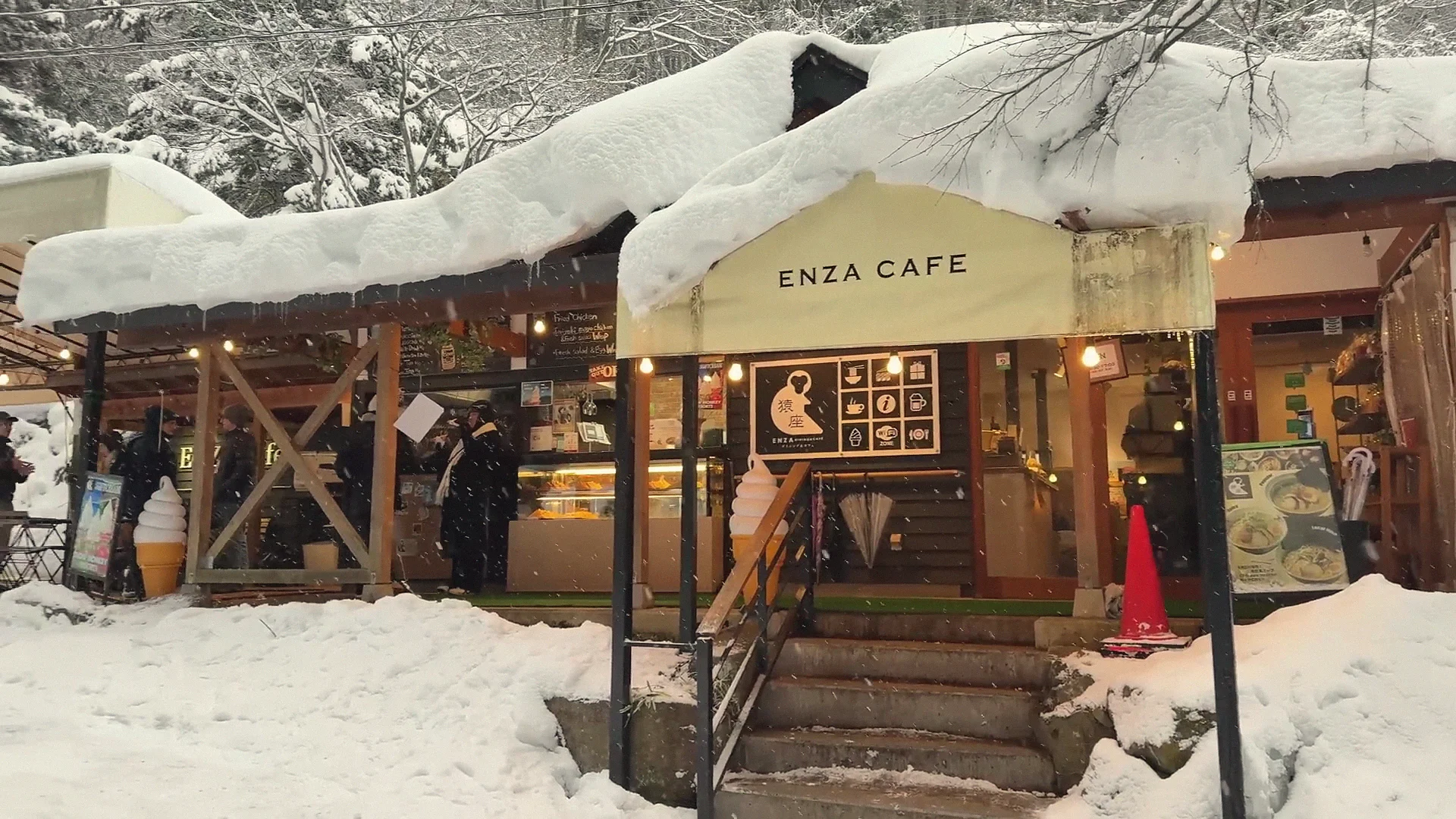 The snow-covered Enza Café at the Kanbayashi trailhead to Snow Monkey Park, with its soft-serve and menu boards.