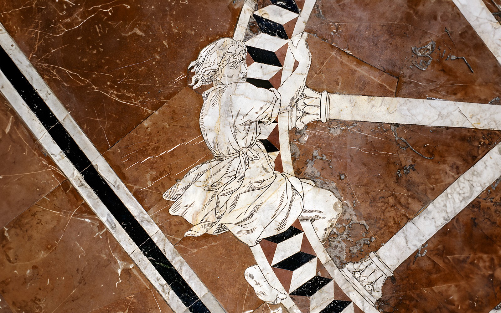 Marble inlay artwork on Siena Cathedral floor depicting a historical figure.