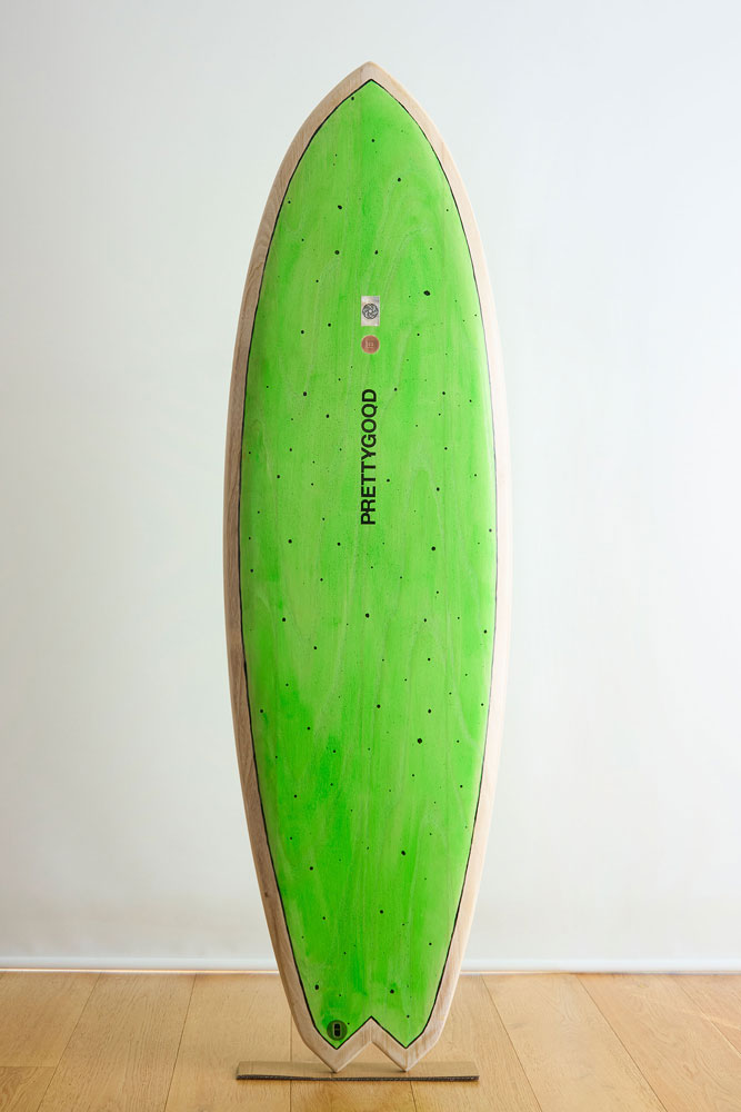 Green painted wooden fish surfboard