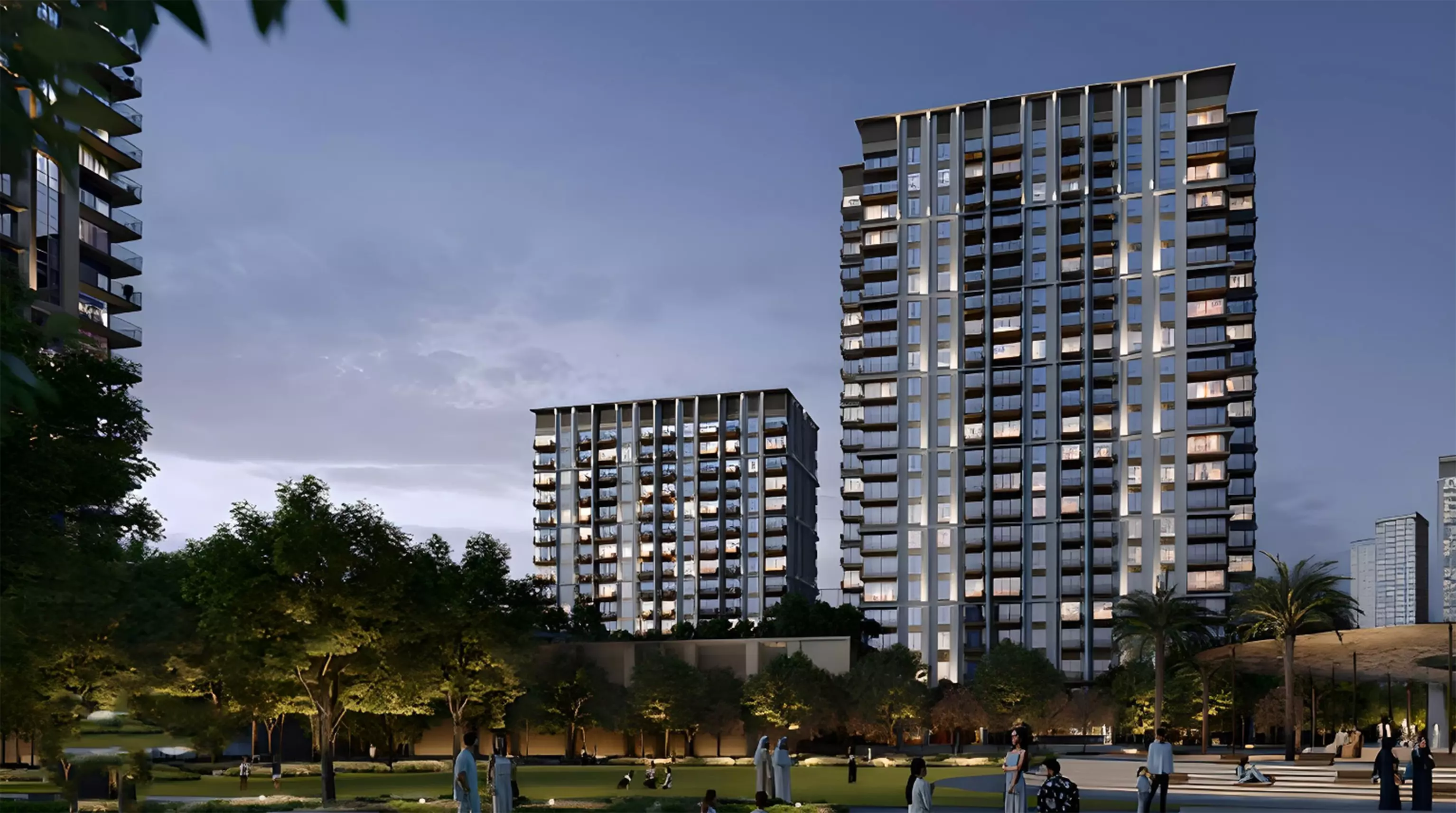 Sunset view of Emaar Altus residential towers surrounded by landscaped gardens in Dubai.