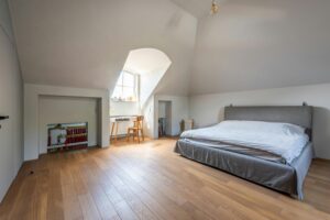 Illustrated breakdown of a permitted development loft dormer extension, highlighting roofline alterations, added internal space, and compliance with UK planning guidelines.