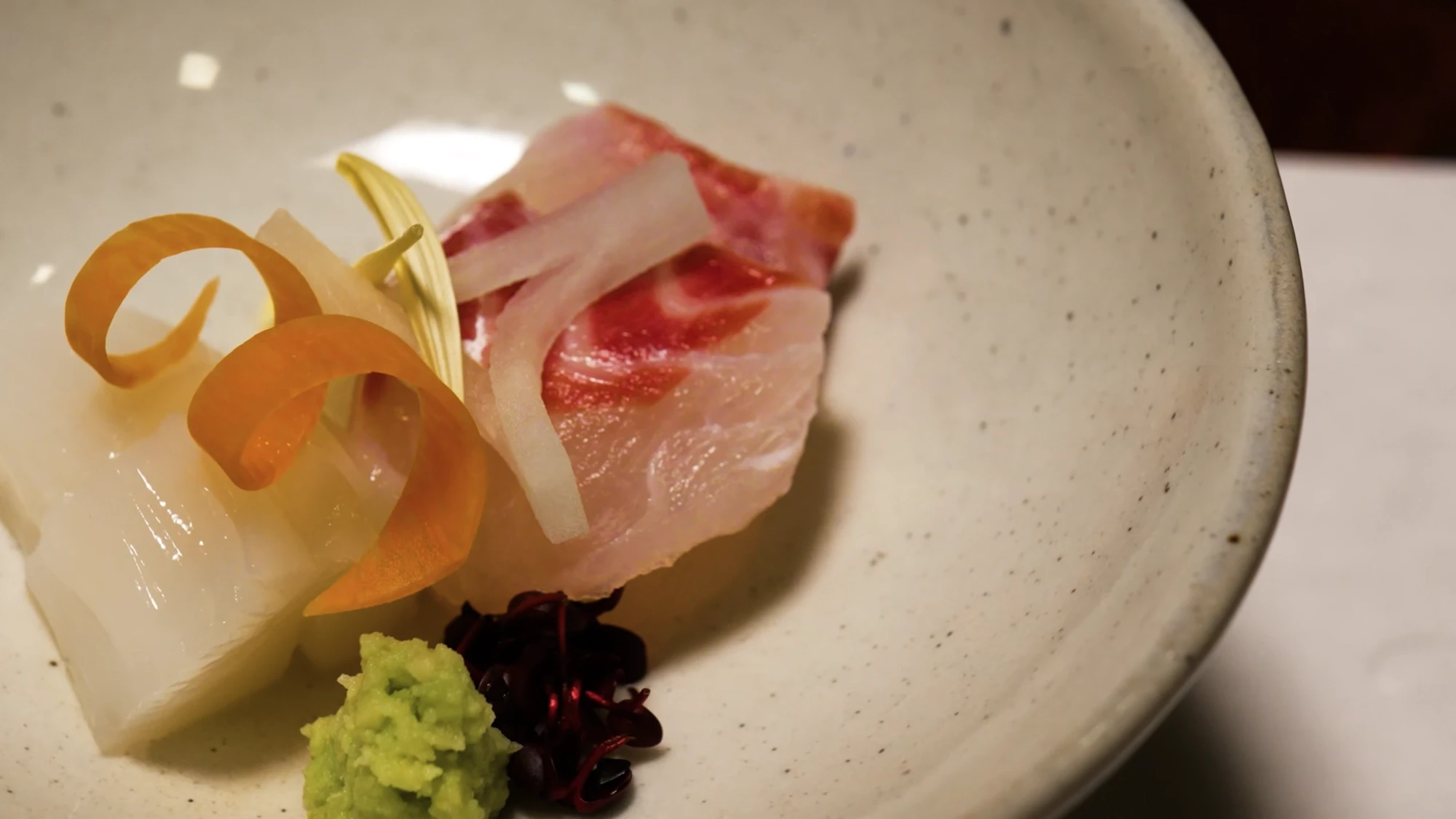 Sashimi with wasabi on a pale ceramic dish at Kurokawa Onsen