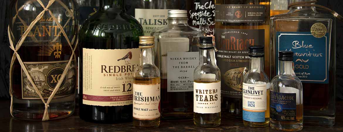 scotch whisky bottles and irish whiskey bottles in a collection