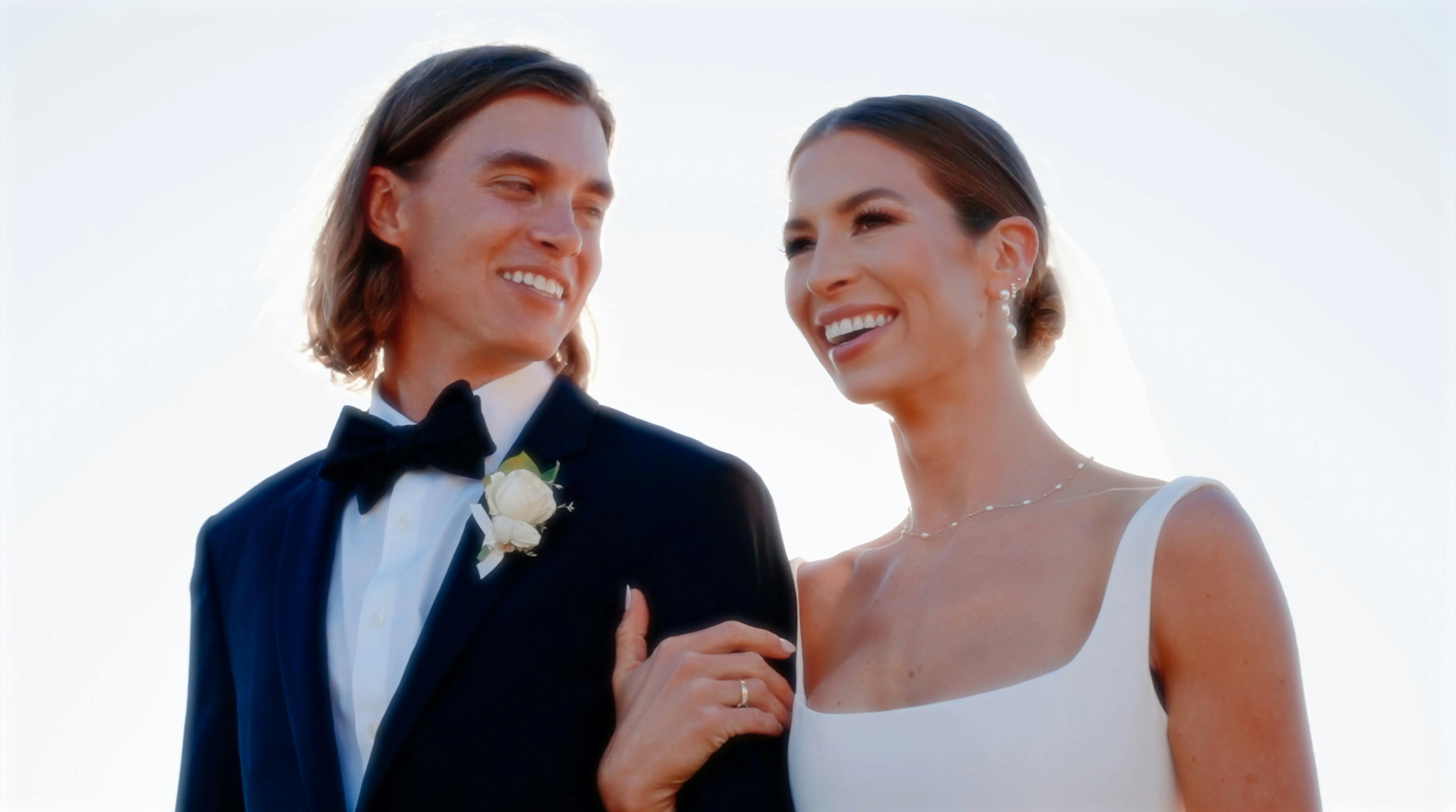 Emma and James smiling together in a romantic portrait on their wedding day