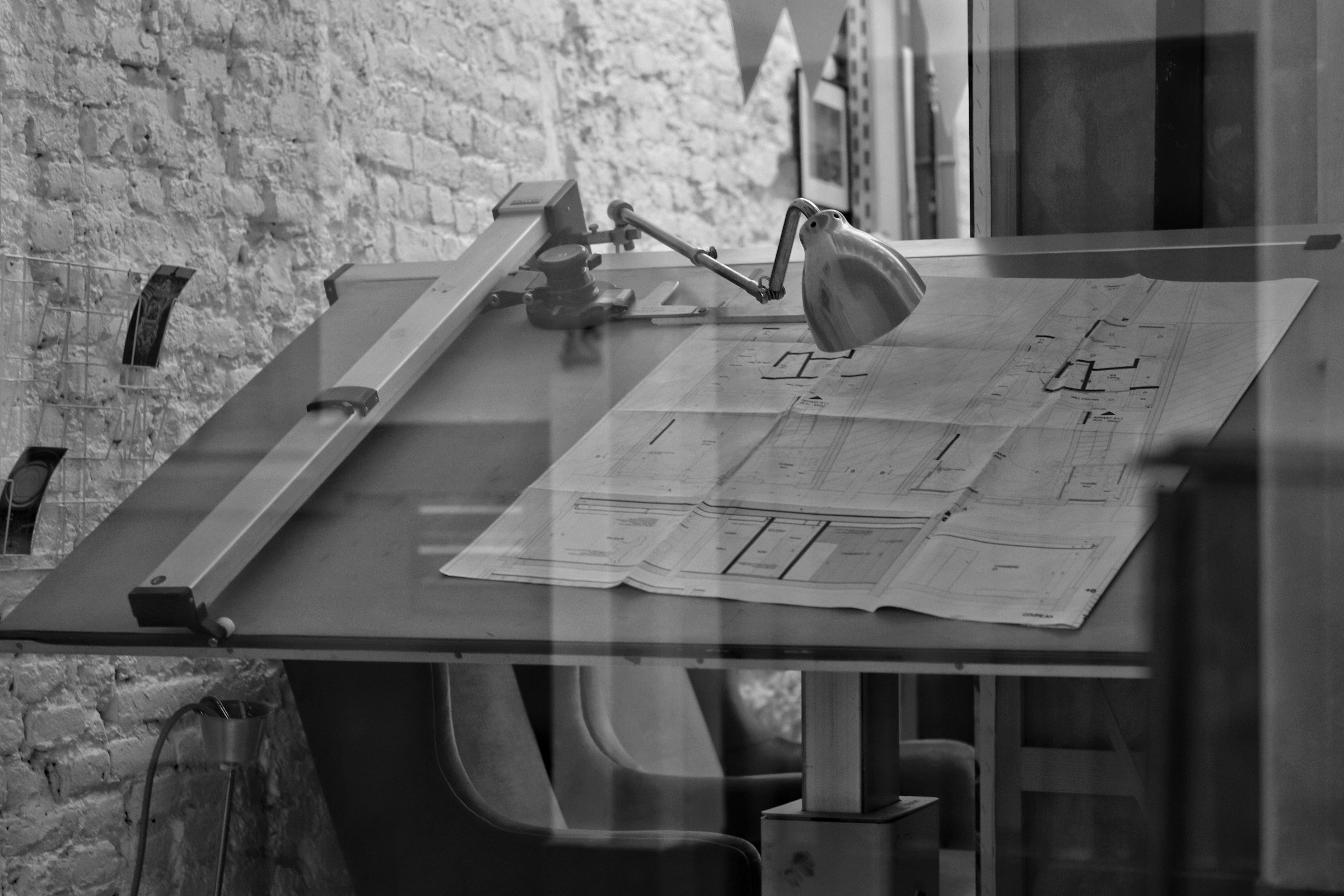 Drawing table with section drawings and pencils