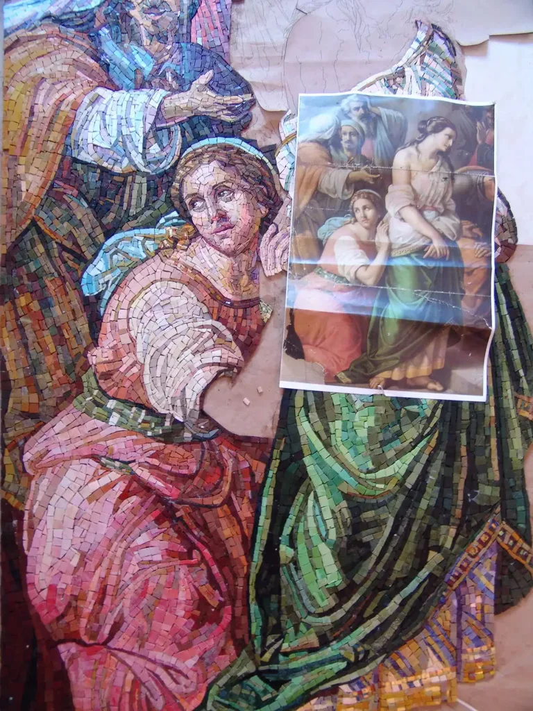 Religious mosaic of Mary Magdalene and Jesus with a printed image overlay.