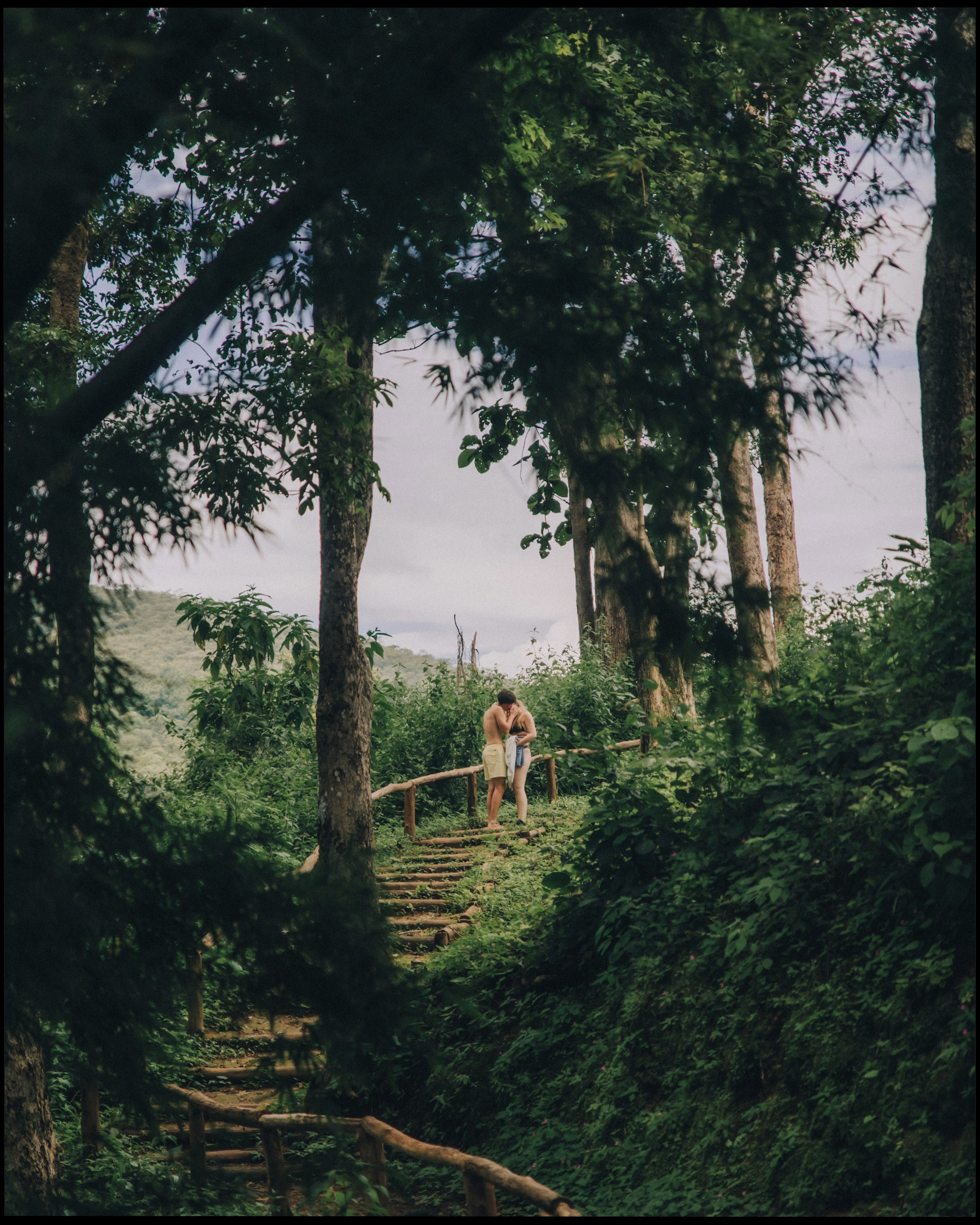 Male sailor from the ACS Independent team focused on steering his boat during the A Division race action.