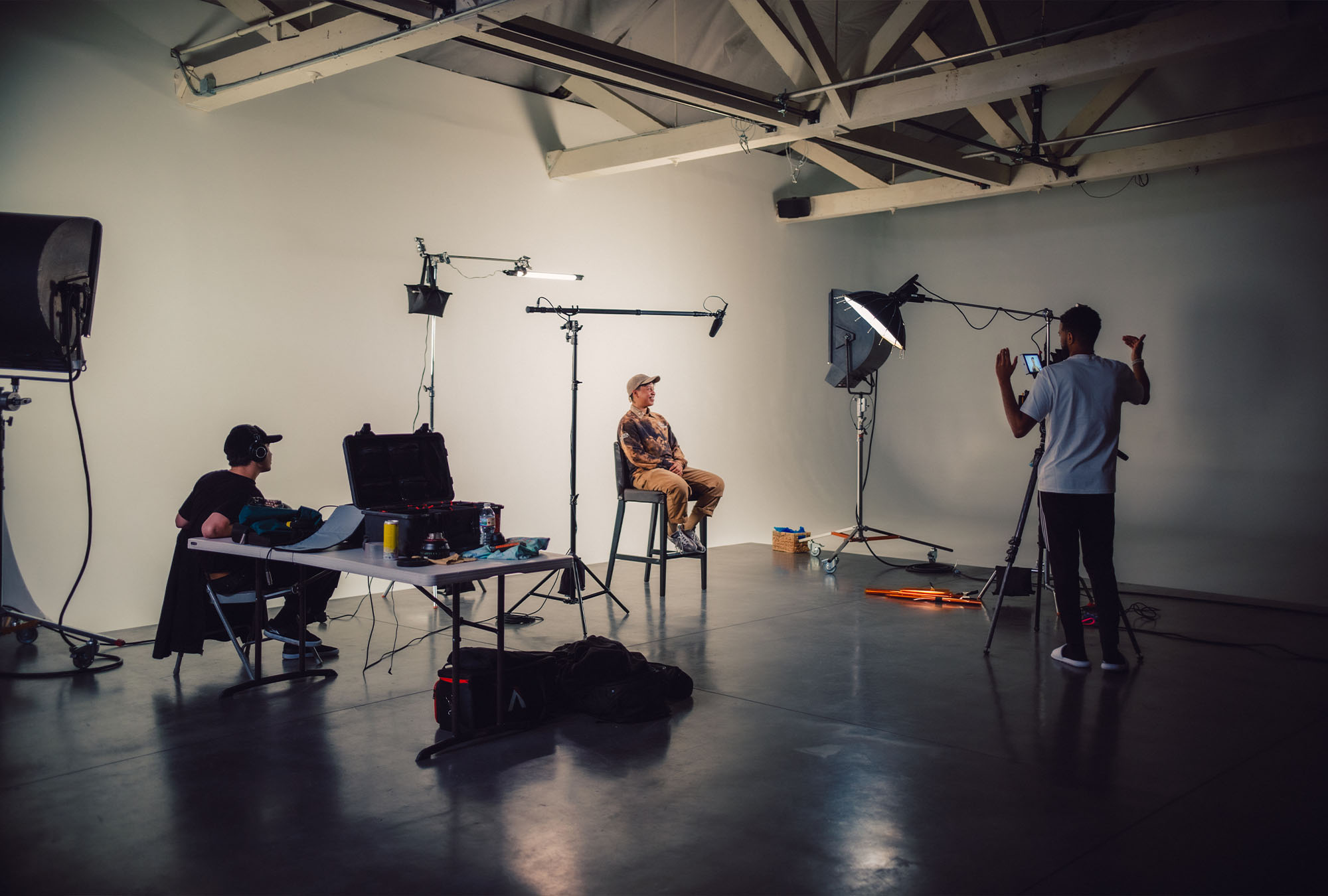 A person is being interviewed on the soundstage of Particle Studio in Seattle WA.