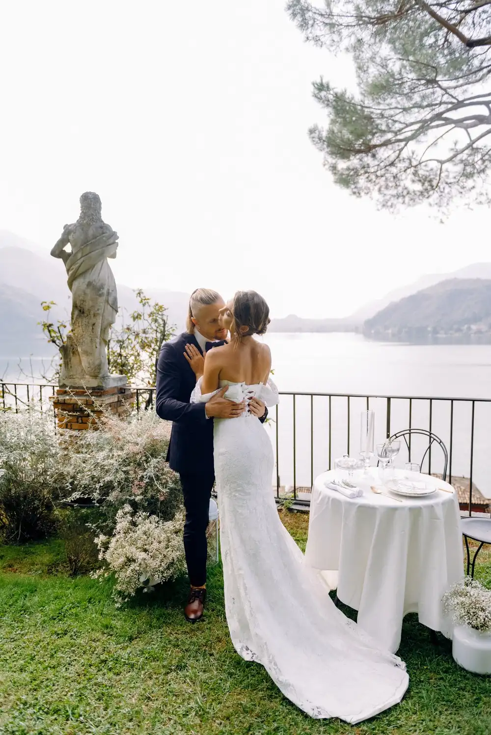 Romantic wedding couple embracing during a golden hour sunset in a Tuscan vineyard, editorial destination wedding archive by Chronique d’Amour.