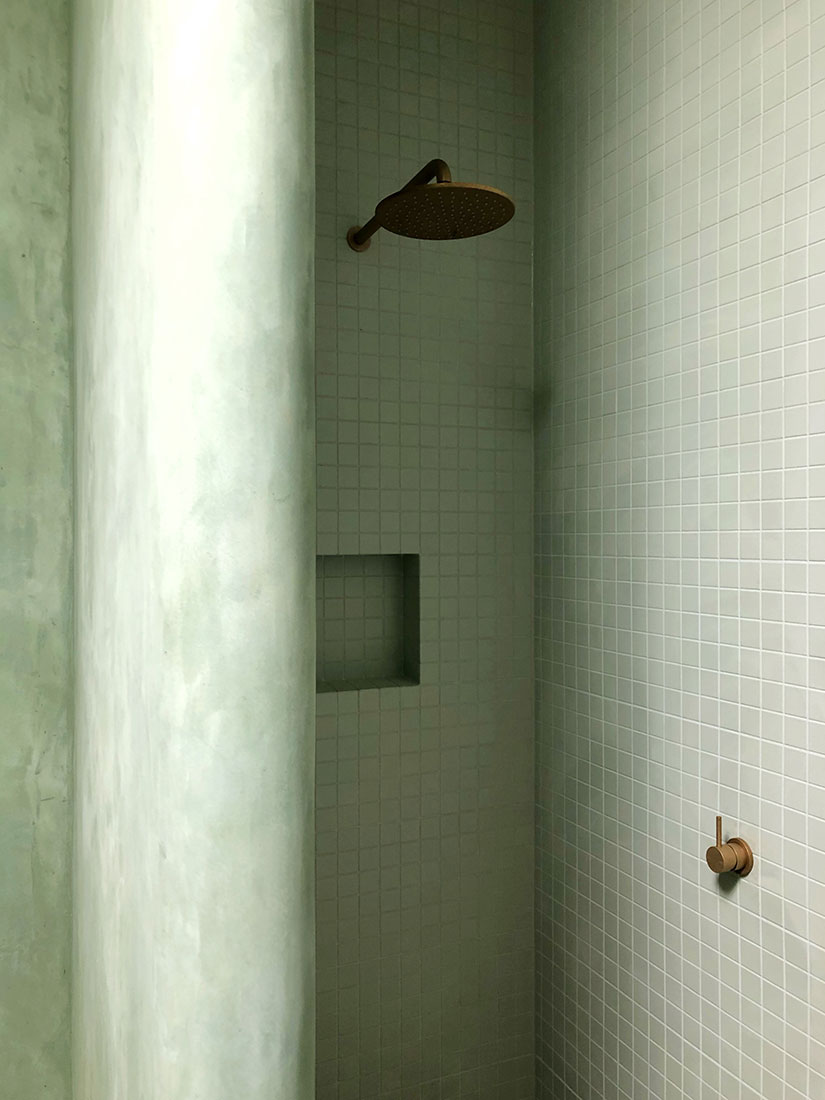 Bathroom with beautiful green marrakech on the walls