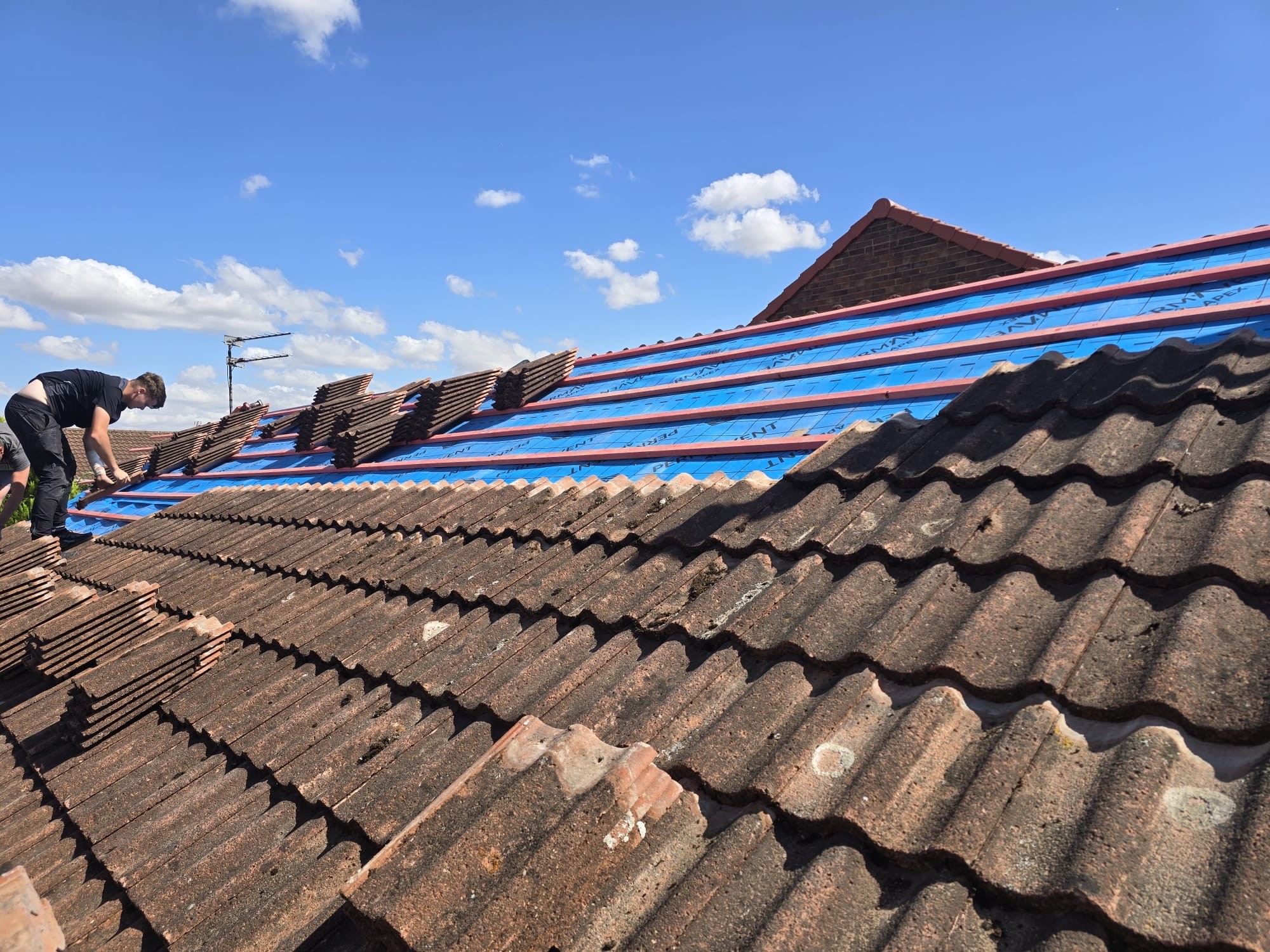 HollyTree team completing a tiled roof installation