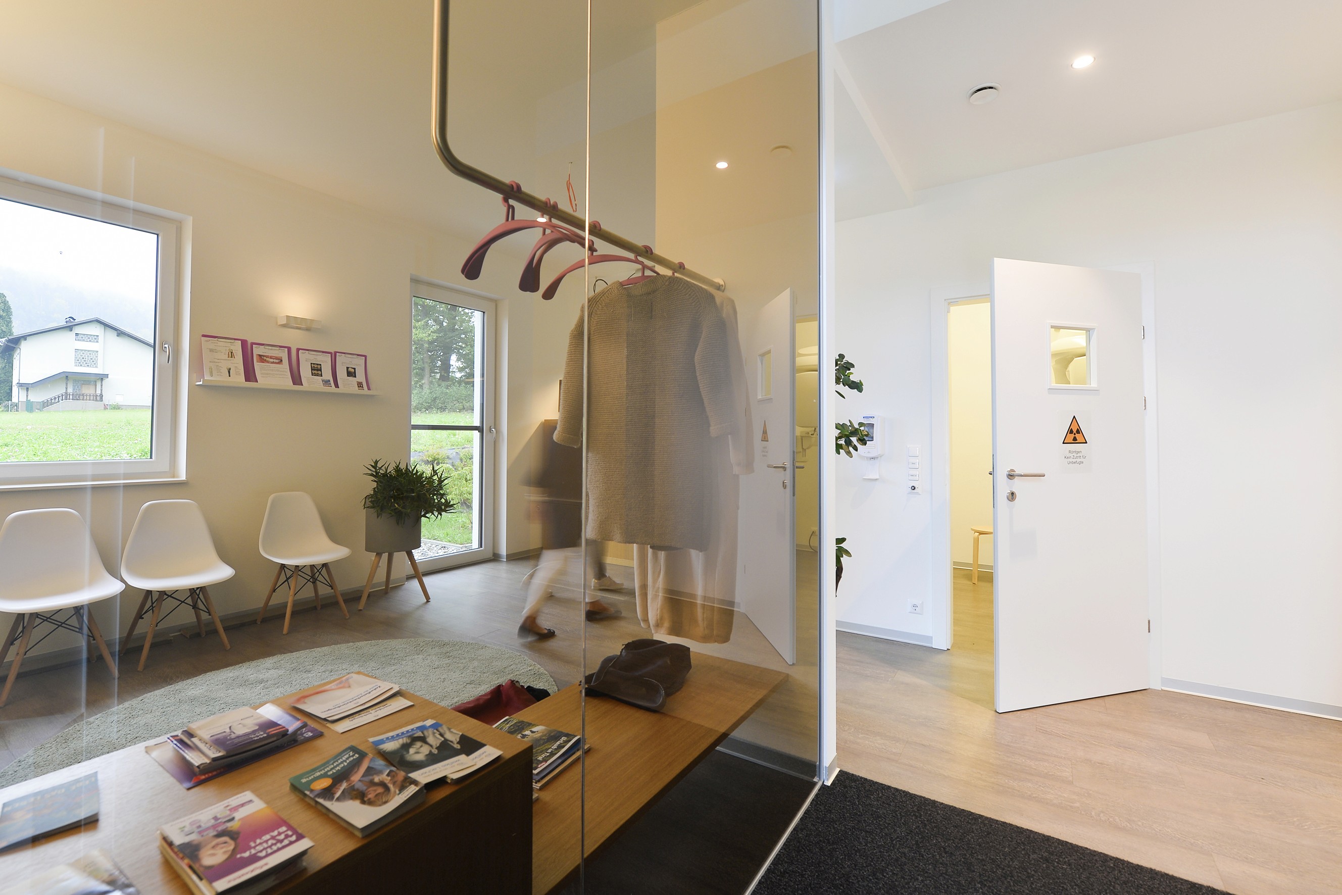 a yellow house with a mountain in the background