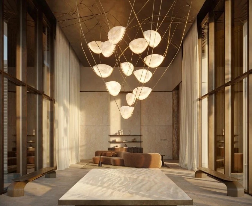 Grand lobby featuring a designer light installation and high ceilings. A hallmark of luxury real estate design.