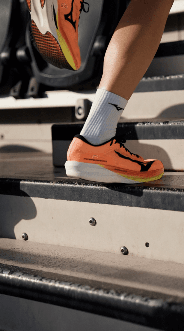 Bride and groom walking on street at night