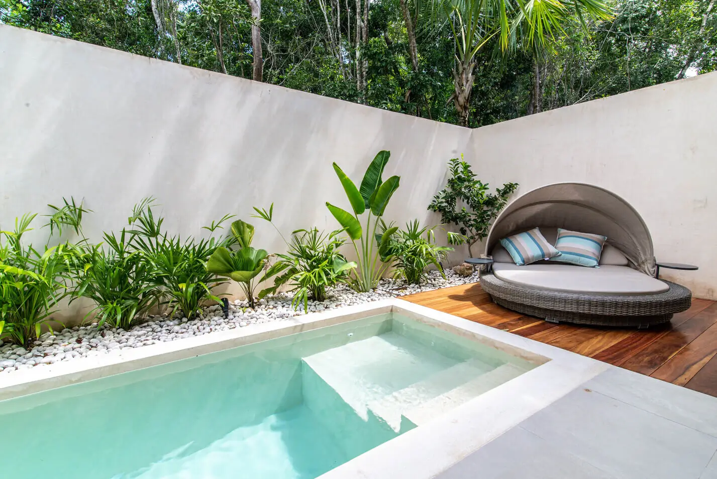 Small patio with private pool in our Airbnb in Playa del Carmen with a sun bed