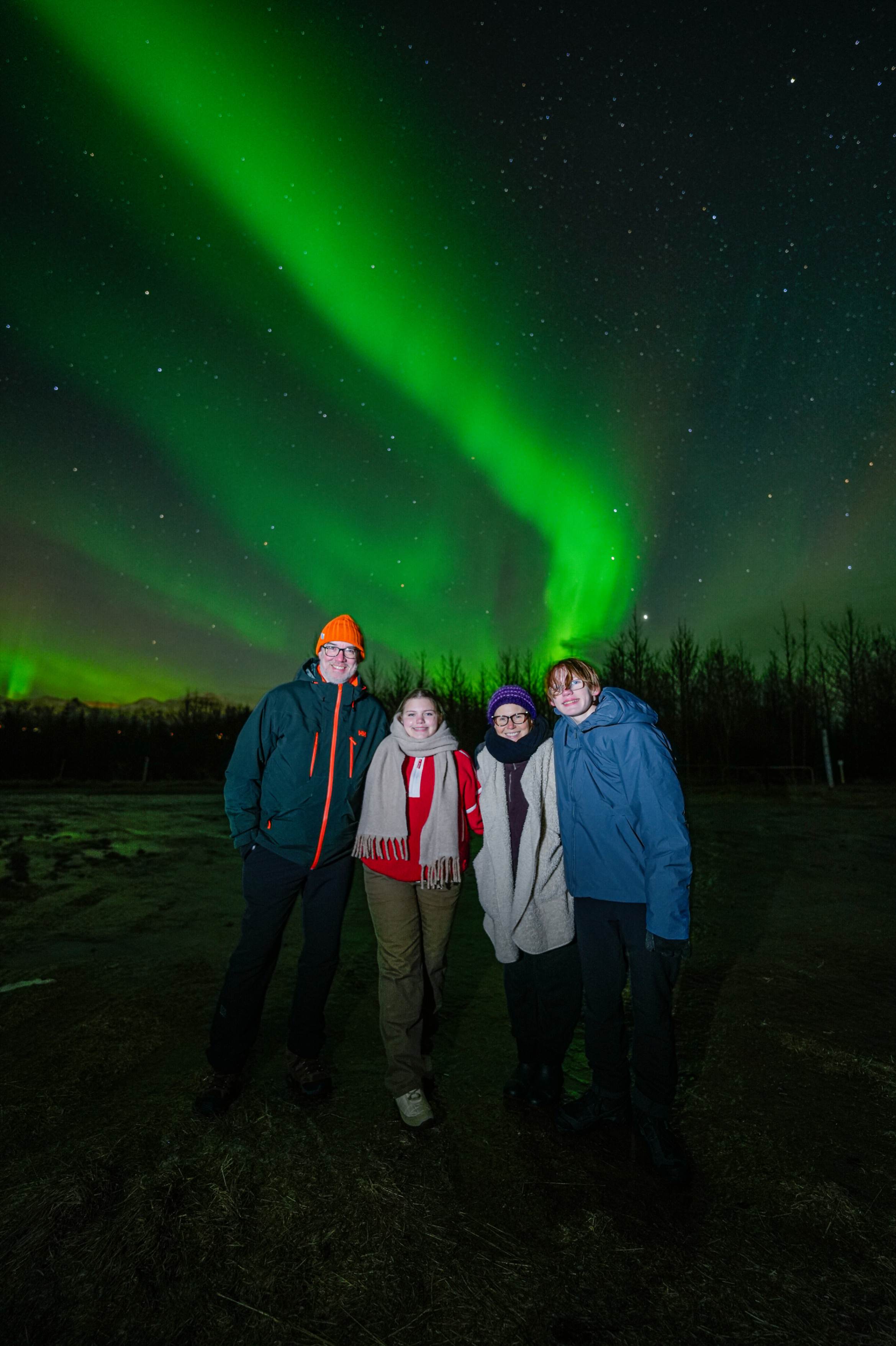 Northern Lights tour photography from Aurora Experts in Iceland, featuring guests beneath the aurora, winter landscapes, and vivid skies over remote Icelandic locations.