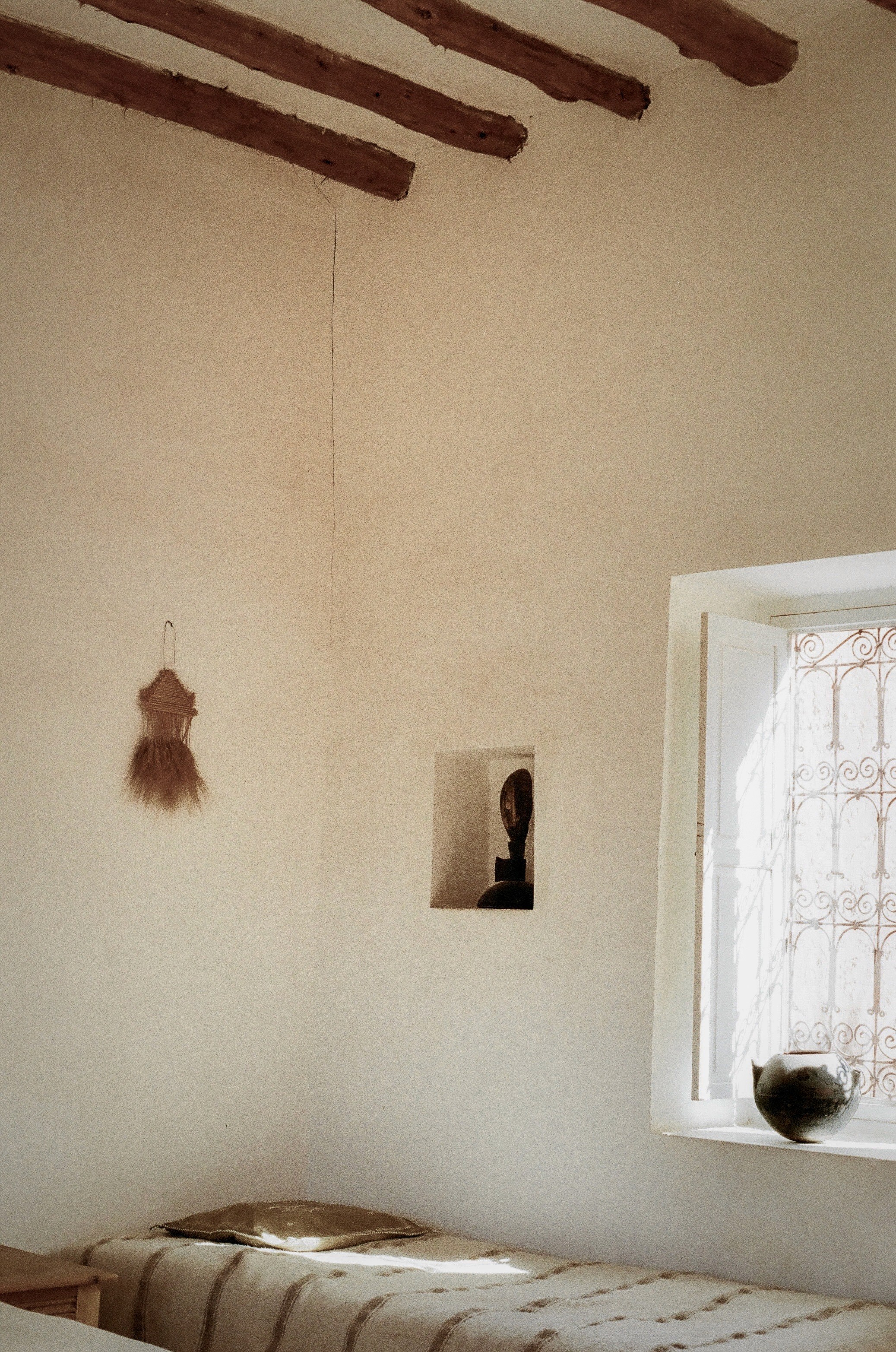 Textured wall and furnishings inside Dar Tasmayoun, Morocco.