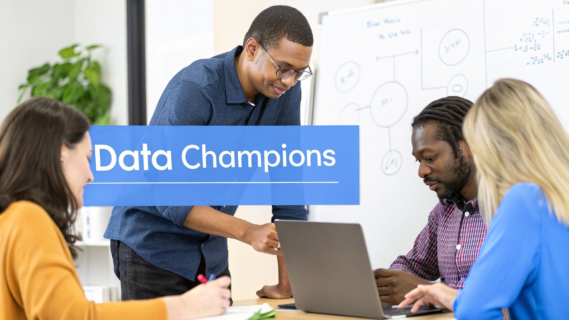 Diverse team of data champions collaborating in an office, discussing information with a laptop.