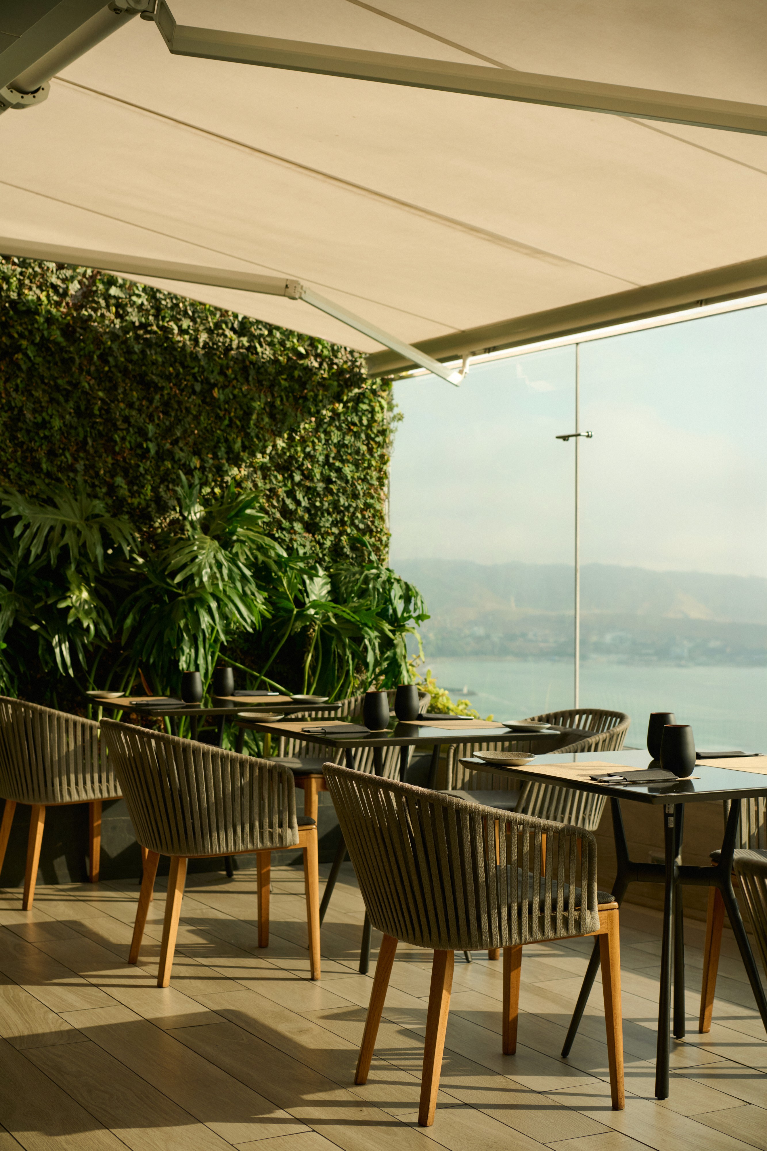 two women talking while holding drinking glasses