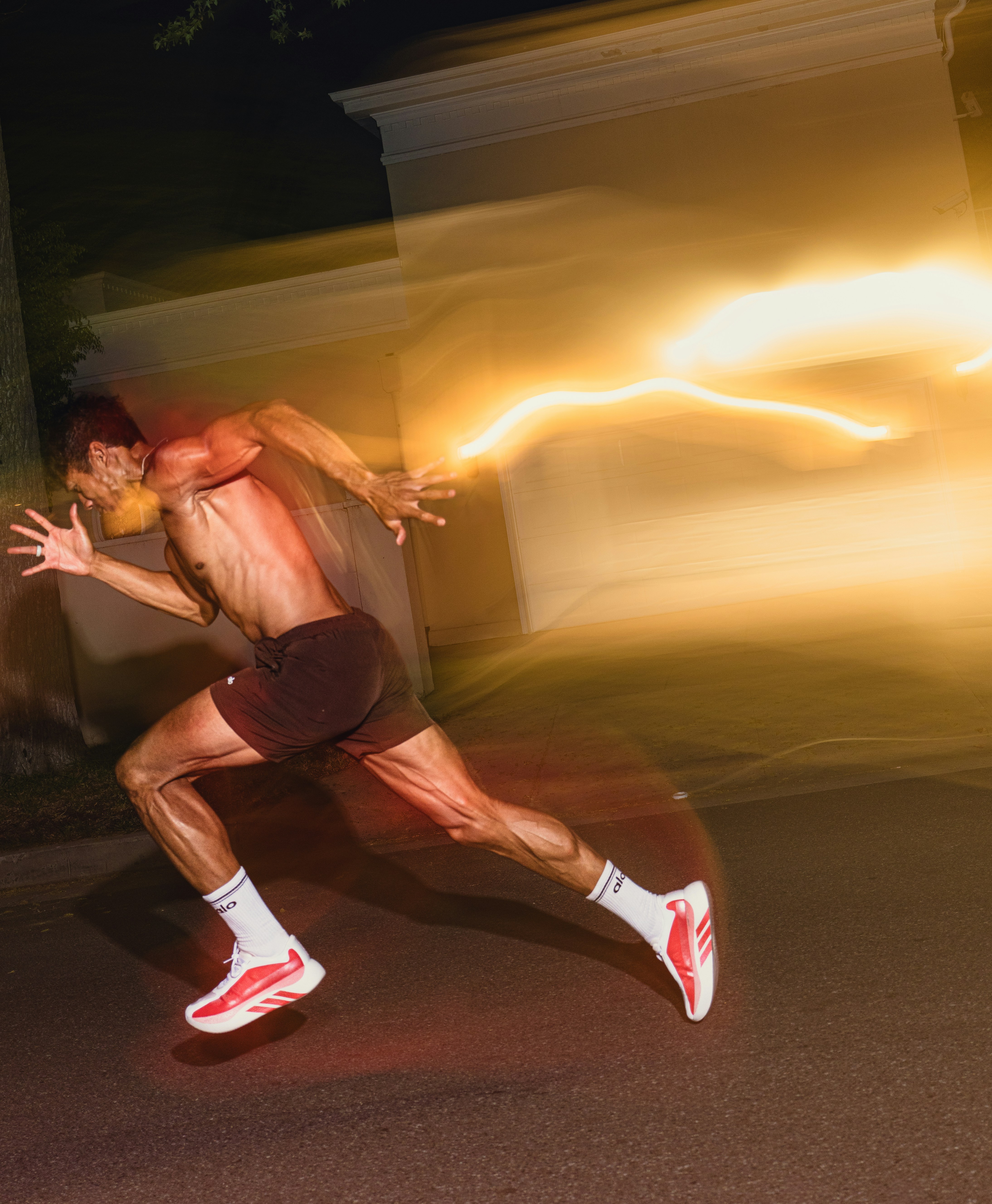 Man running fast at night with motion blur