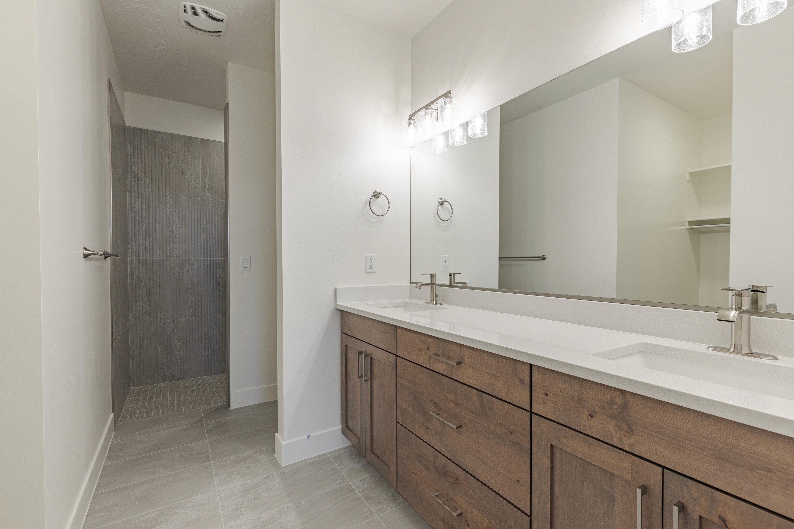 Master bathroom in the Painted Sands twin home in Hurricane, Utah with modern vanity and functional layout.