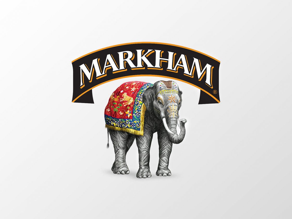 Rustic cabin in a golden field at sunset