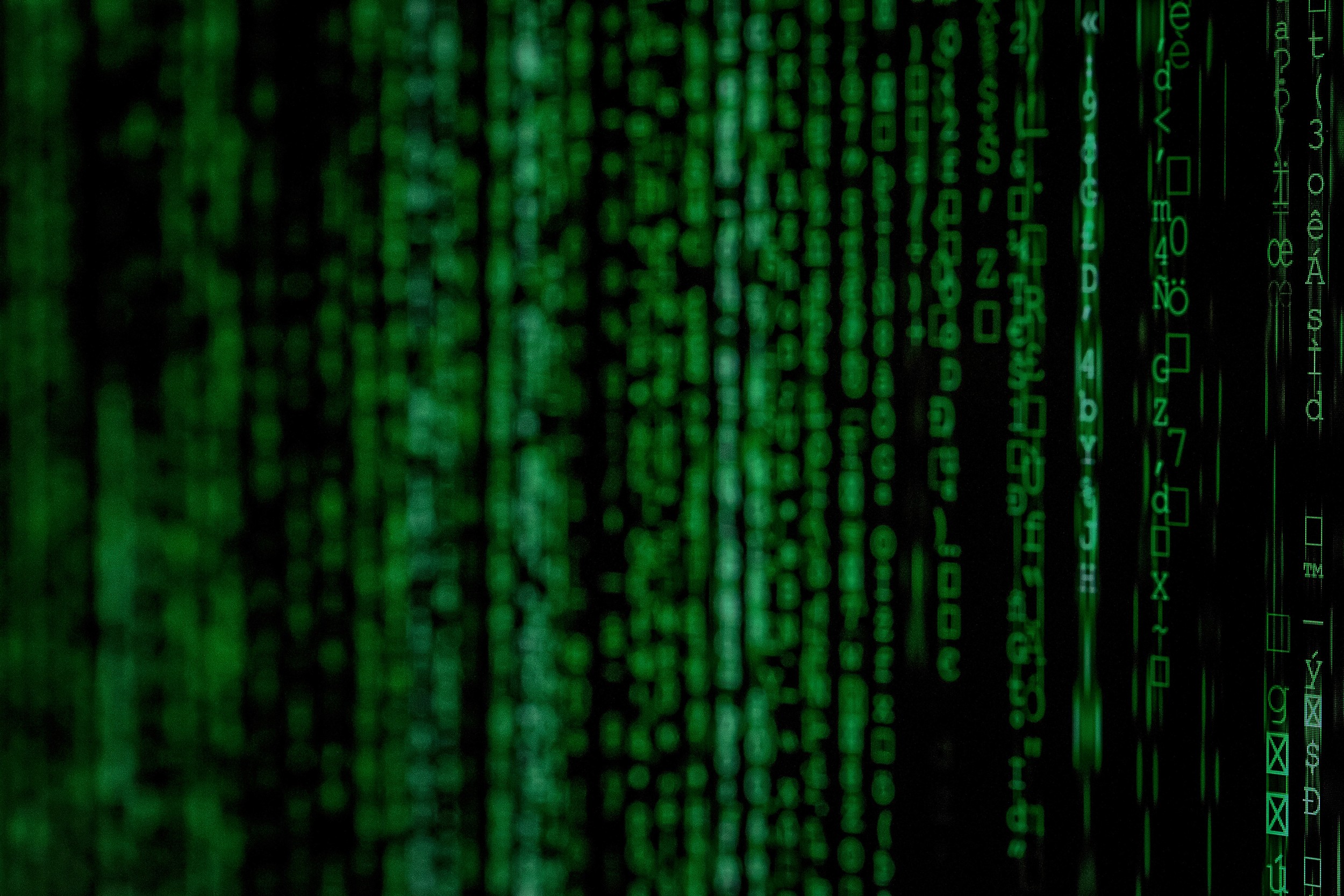 Code on a screen that looks like the Matrix