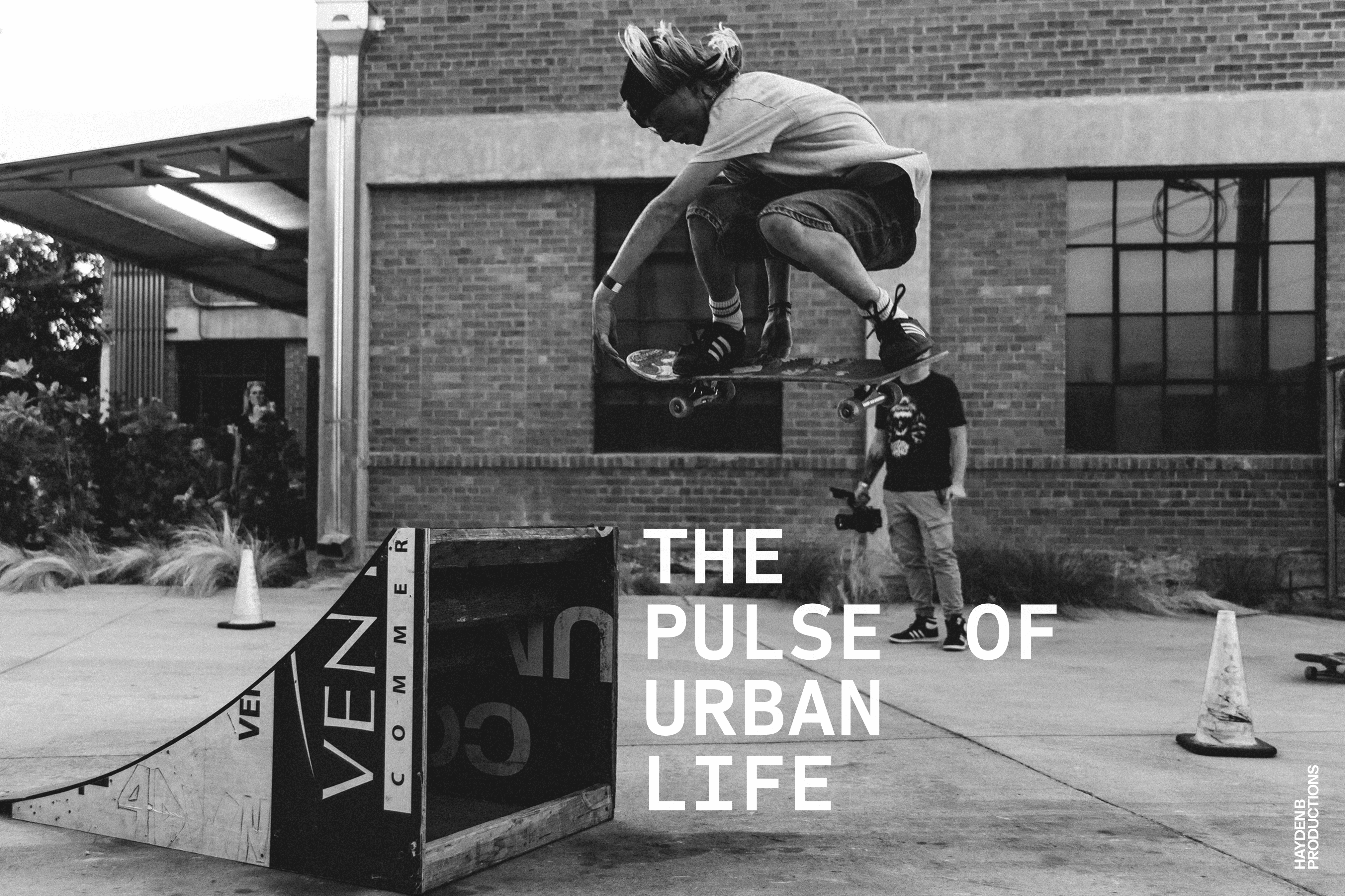 Streetside billboard with flyposters of the Batch.Works brand and illustrations