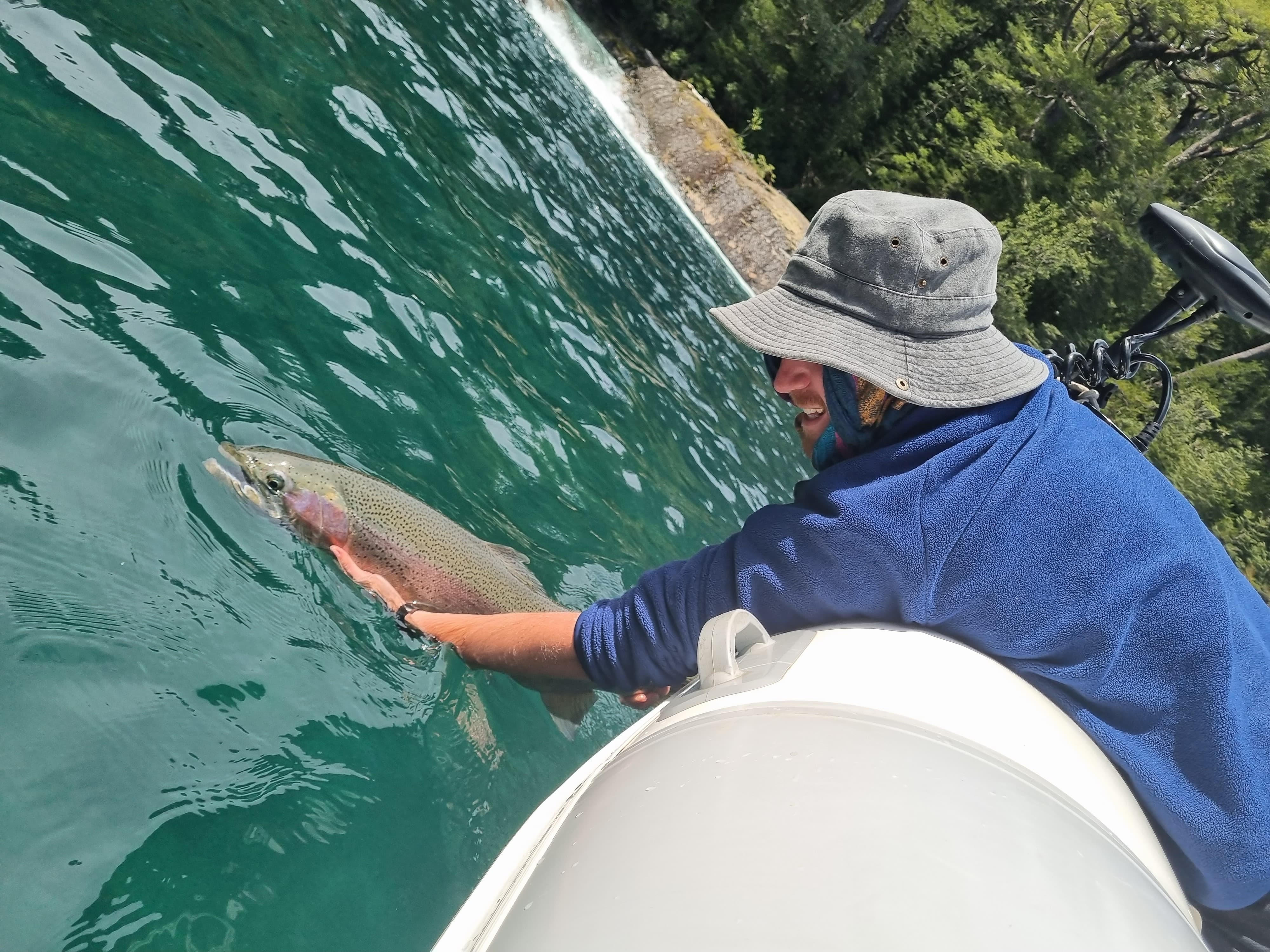 releasing a trout fly fishing in Patagonia