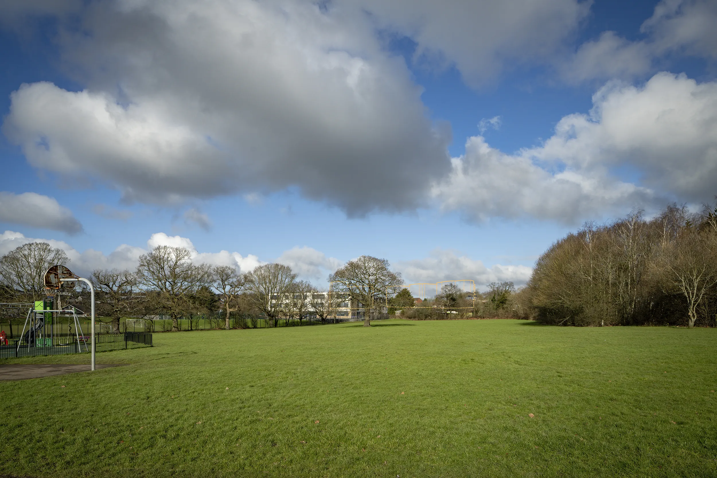 Type 4 AVR Level 1 wireline verified view due north across High Barnet Park, outlining the upper levels of Buildings D and E through a gap in the foreground tree coverage.