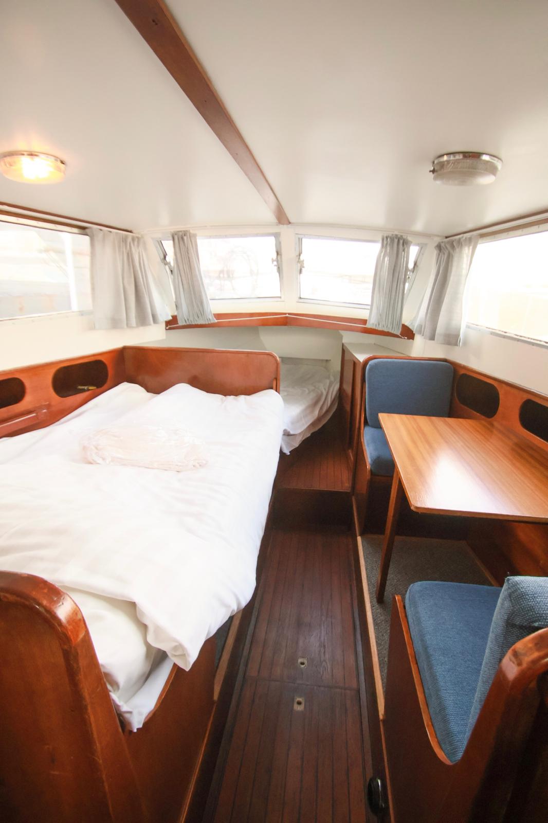Gray sectional sofa with black coffee table and blue rug