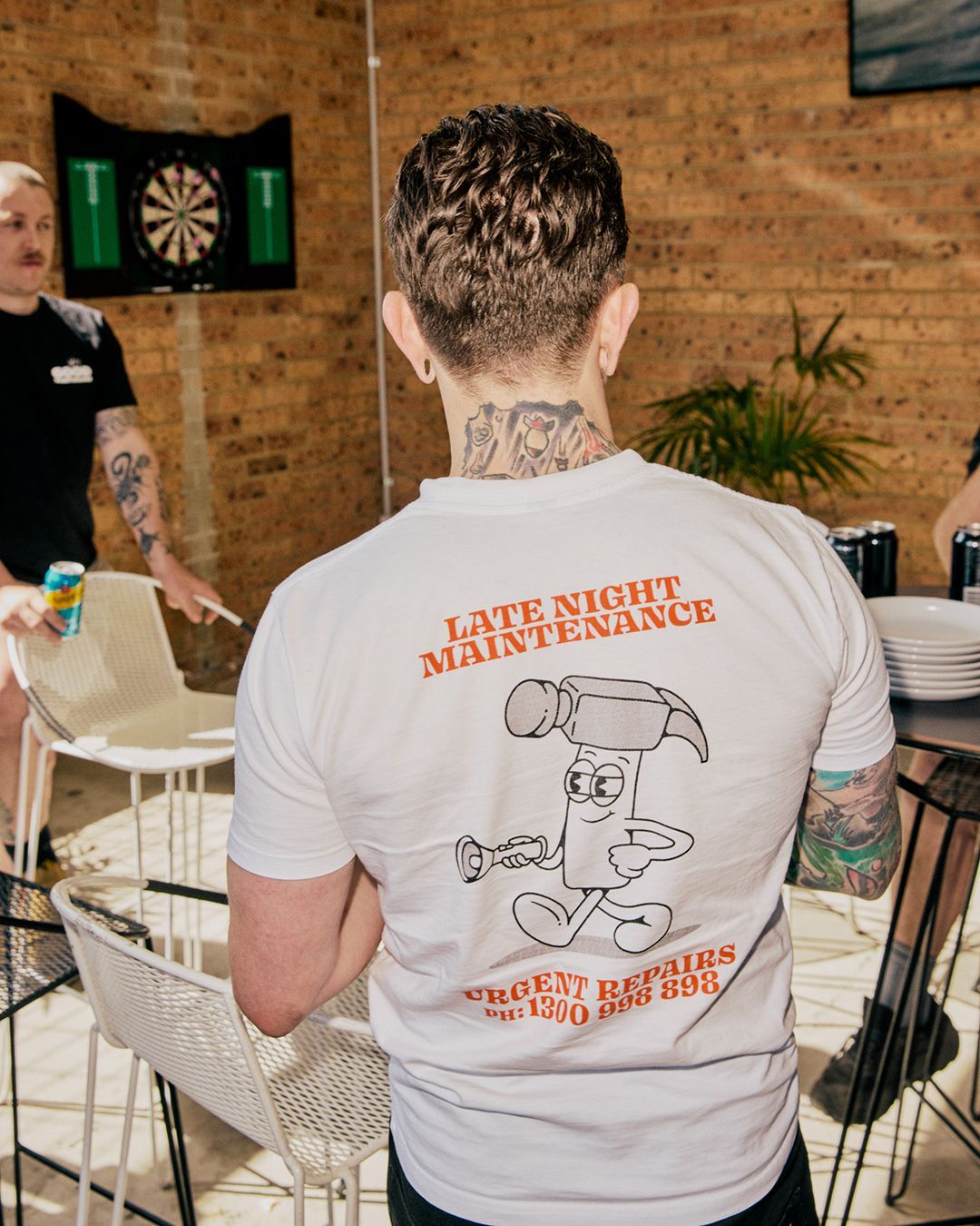 Team member wearing a Late Night Maintenance shirt