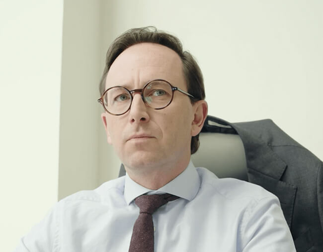 Team members in an office setting having a discussion, representing clear communication throughout the project process.