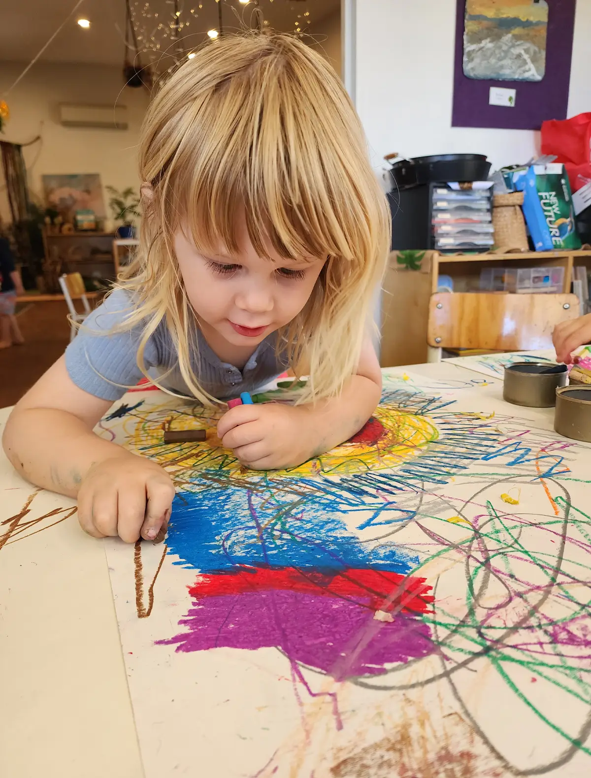 A teacher reading an illustrated book with young children during group time.
