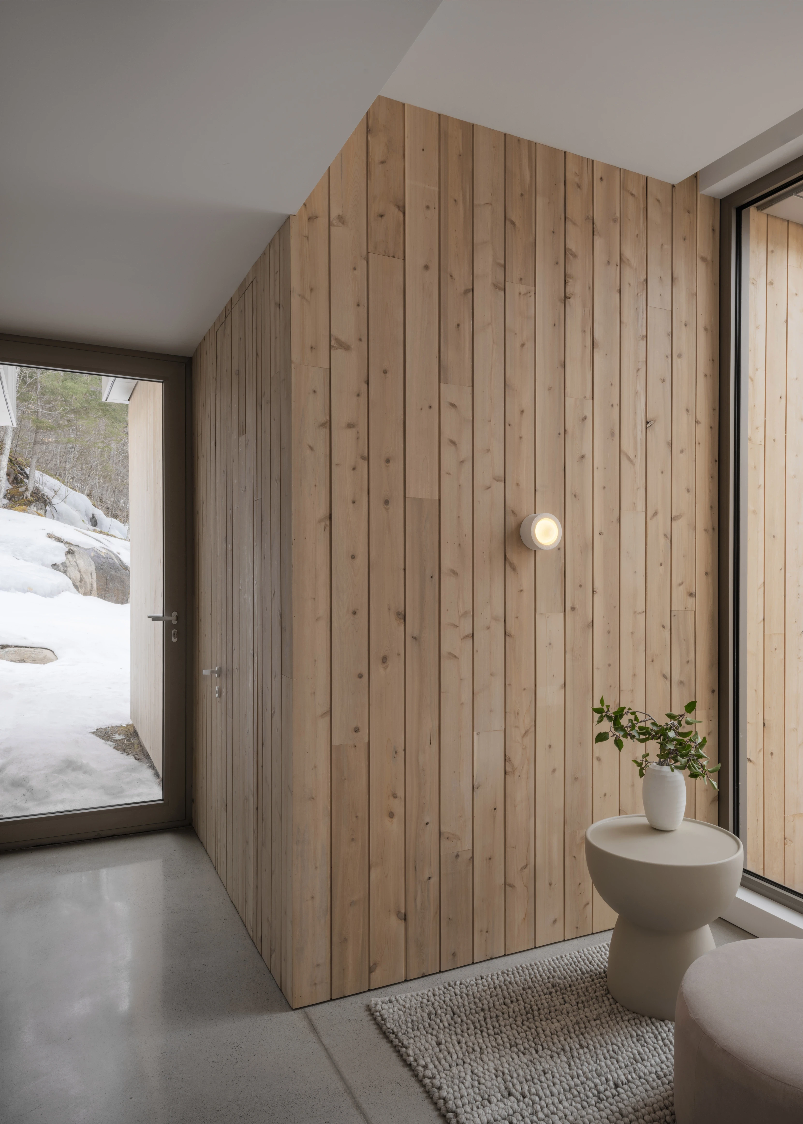 Architectural perspective through a corridor – A hallway with subtle lighting and material interplay, guiding the eye through the space.