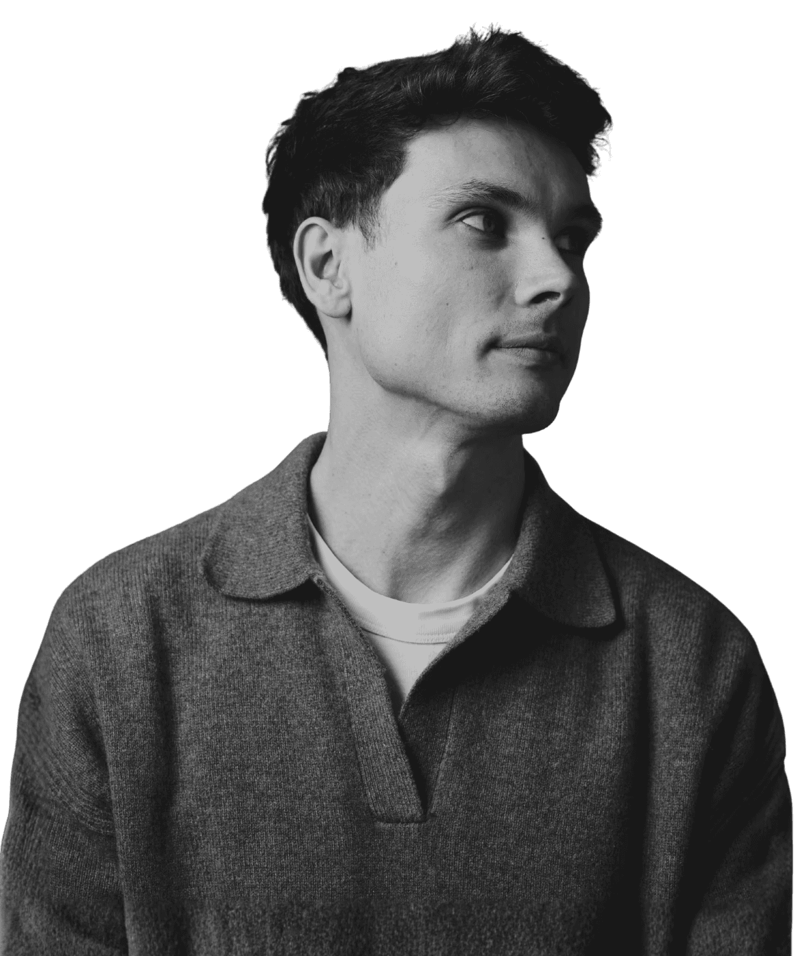 Professional woman in a suit standing in an office setting.