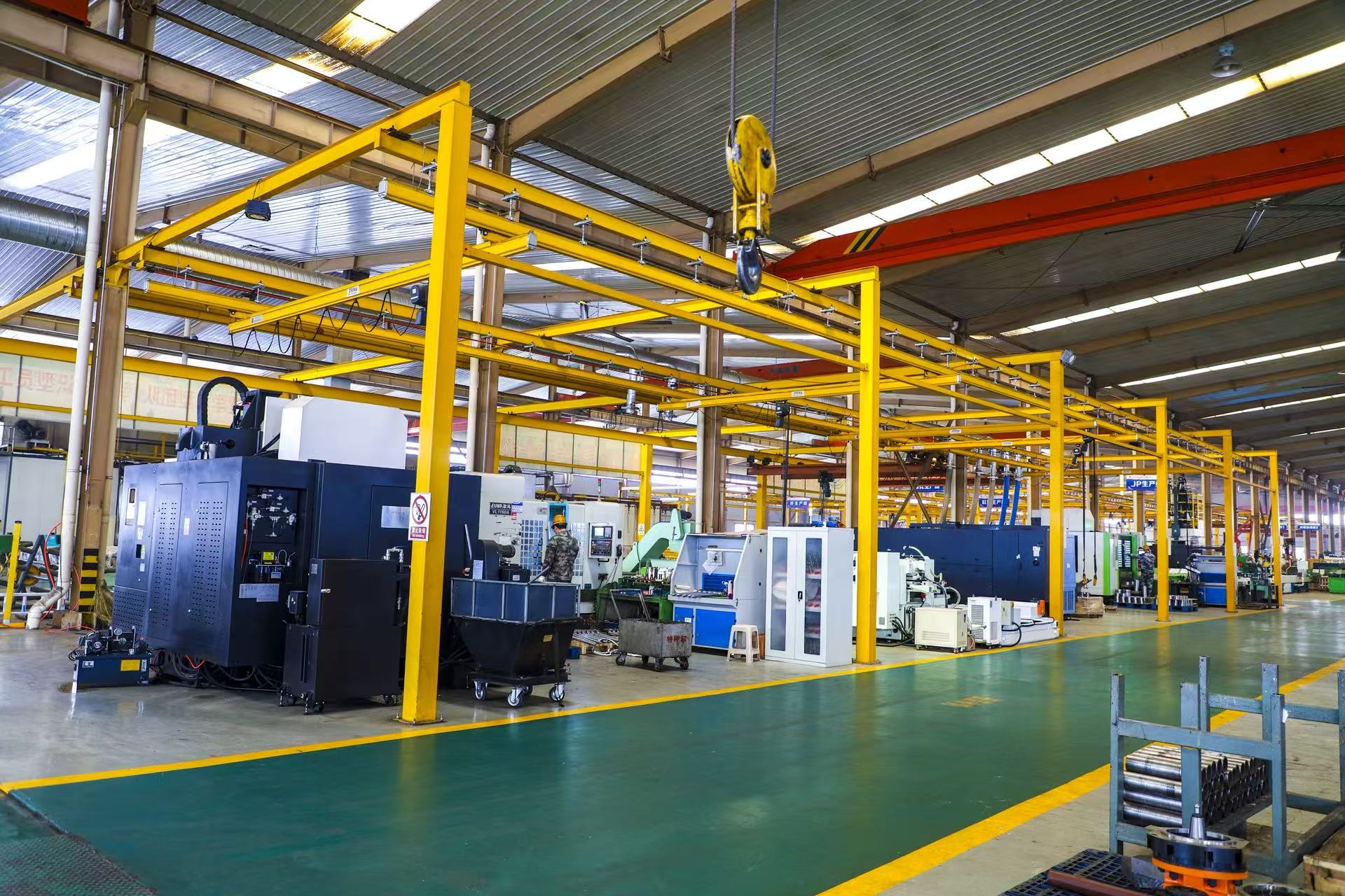 Male engineer in orange uniform and helmet standing with arms crossed          Ask ChatGPT