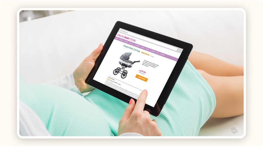 pregnant woman browsing baby shop