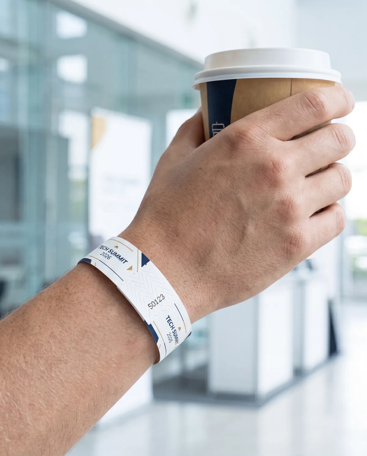 Numbered Tyvek wristband for a conference, worn by an attendee