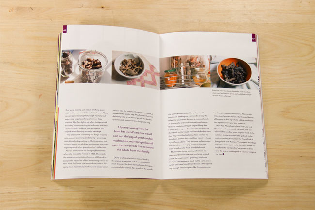 An open cookbook lies flat on a light wooden surface, displaying two pages of text and four photographs of food. The left page contains paragraphs of text, while the right page features four photographs: two in bowls, one on a table, and another on a surface with jars and spices. The book’s pages are white, and the text is in a standard serif font. The photographs show various food items, including what appears to be dried herbs or spices in bowls and jars. The lighting is even, and the focus is sharp, allowing clear visibility of the text and images.