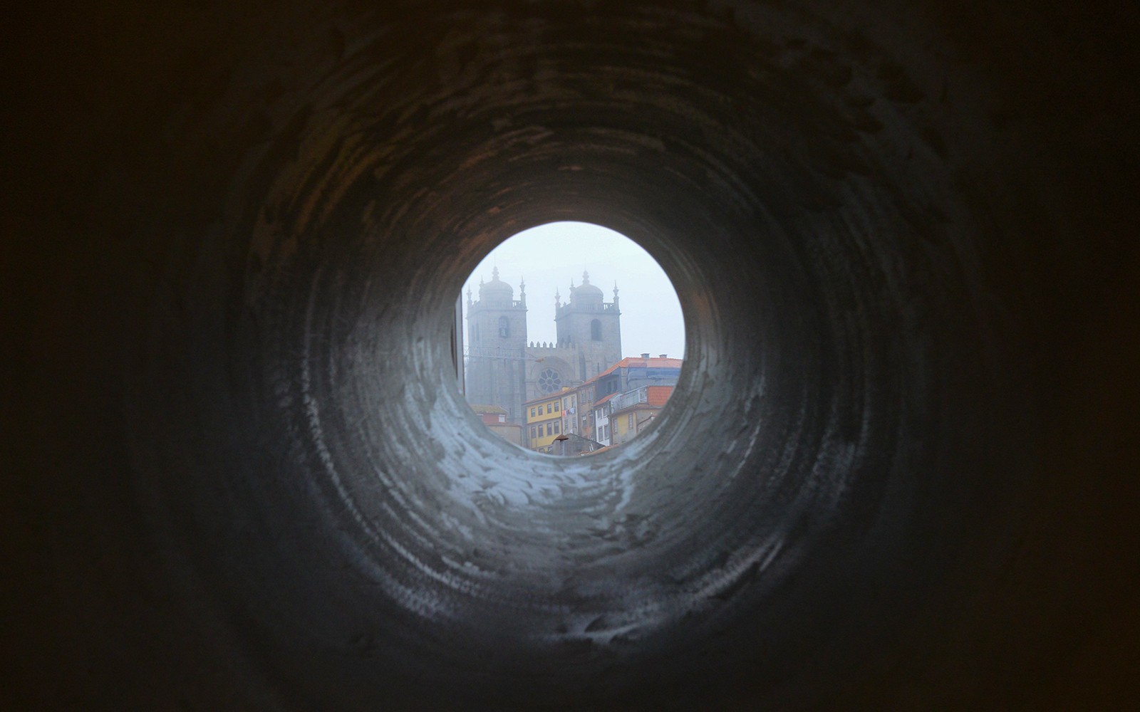 View of Porto Cathedral through a circular tunnel, Porto, Portugal.