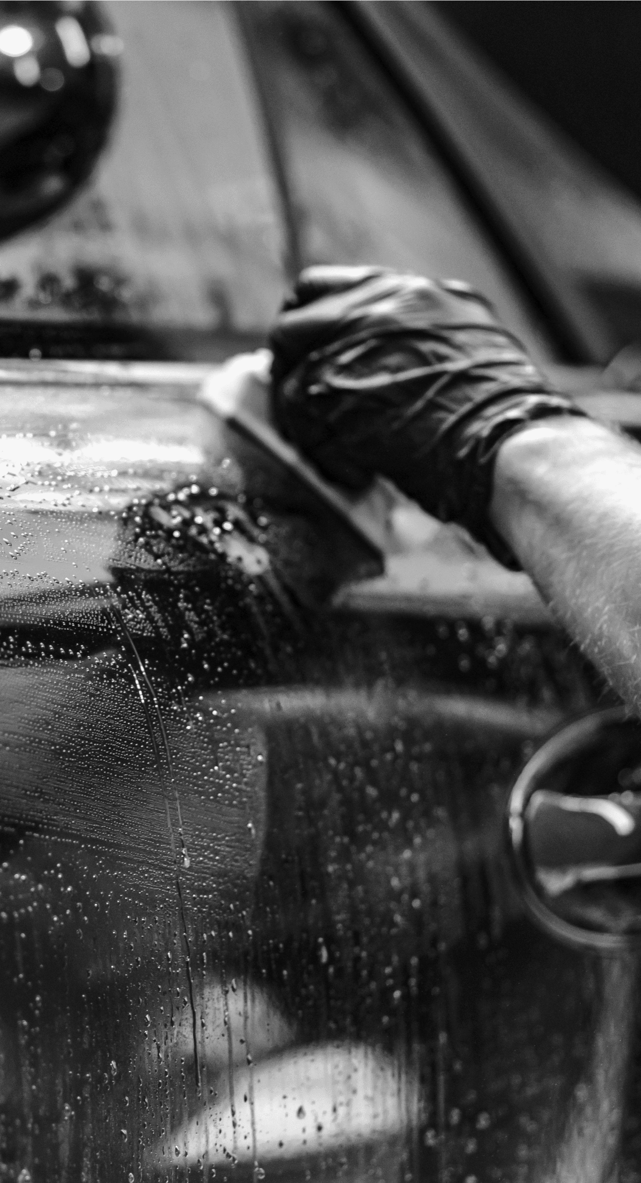 A Veyra detailer washing a vehicle