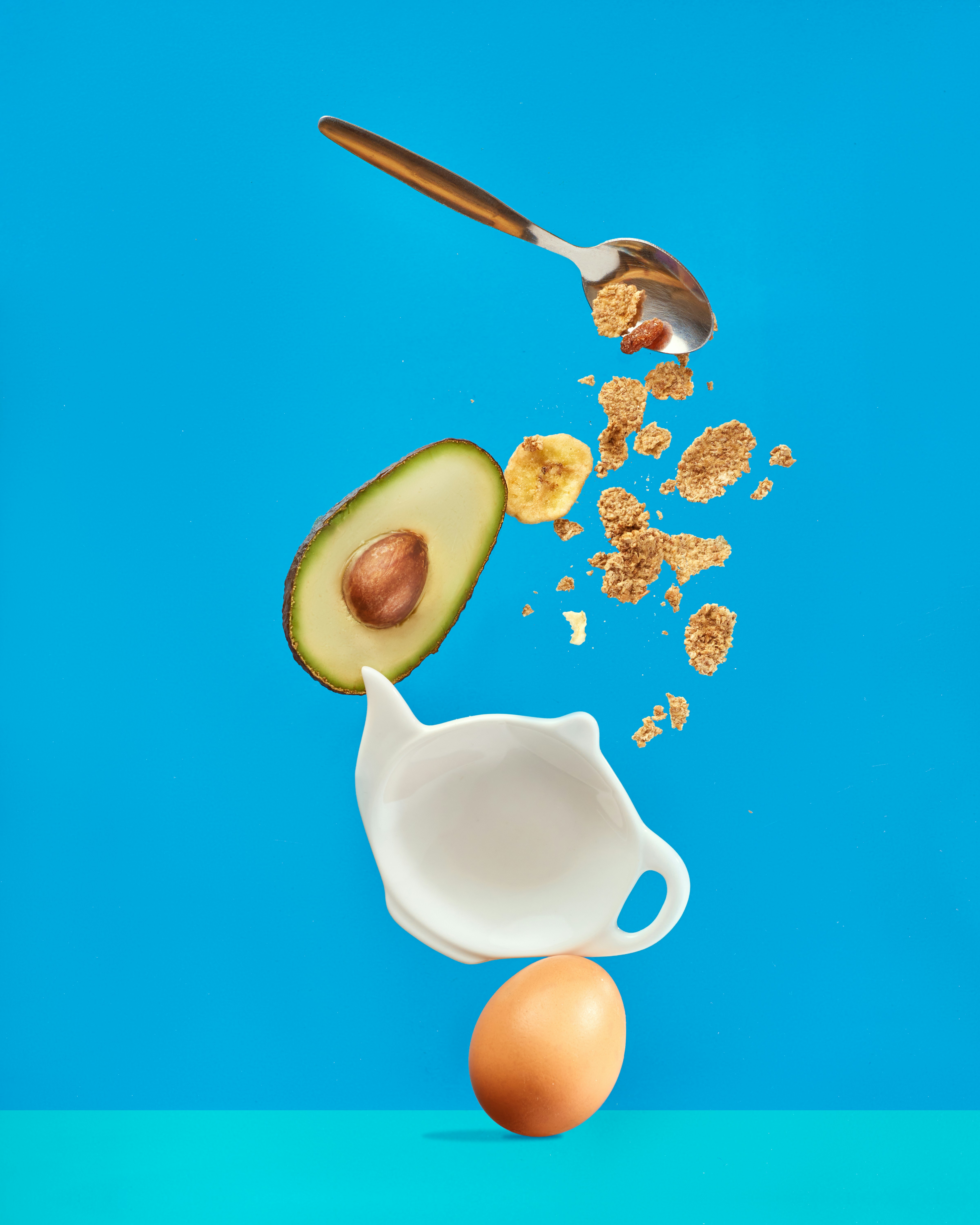 white ceramic mug with silver spoon