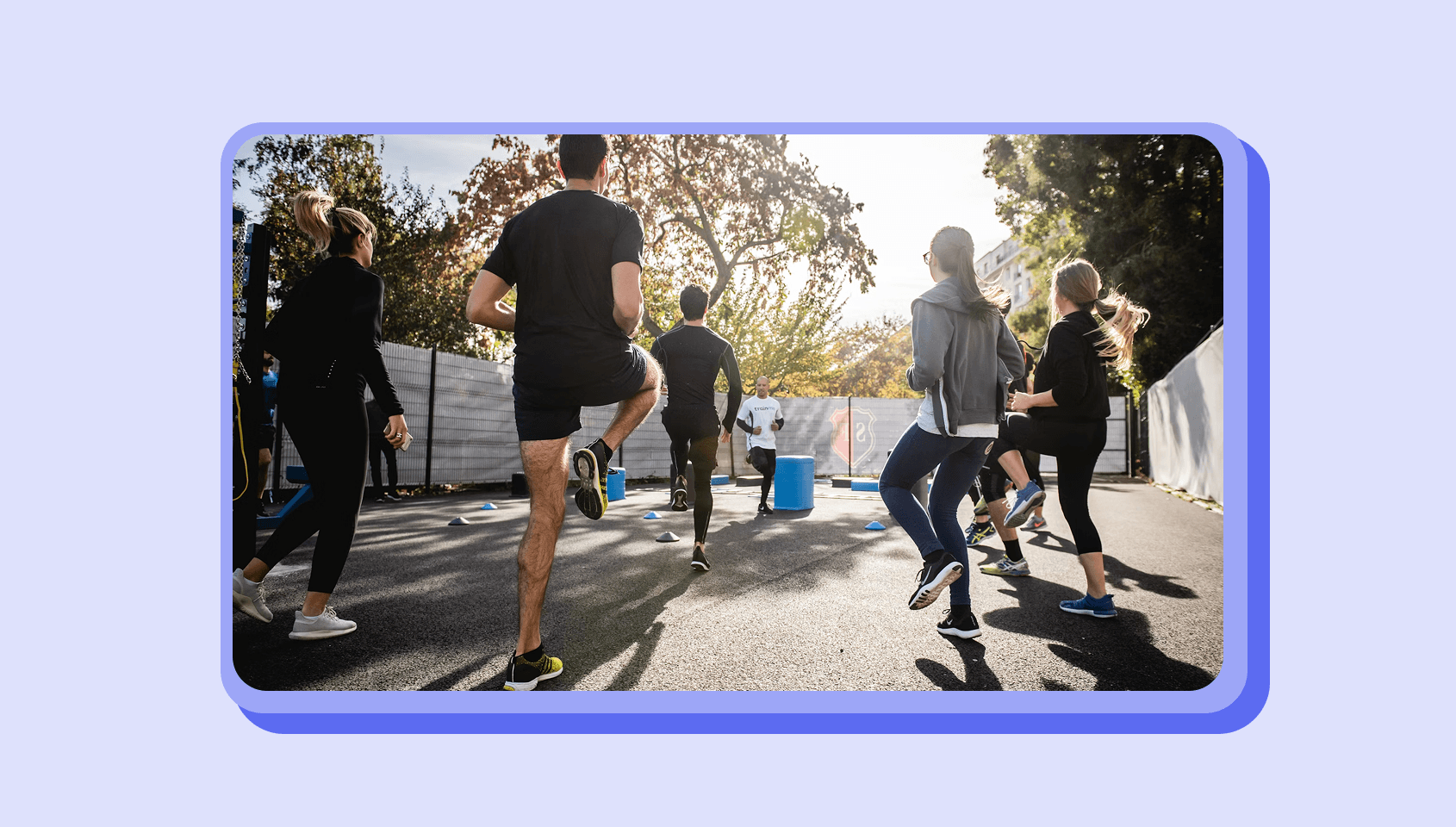A fitness coach teaches his clients.