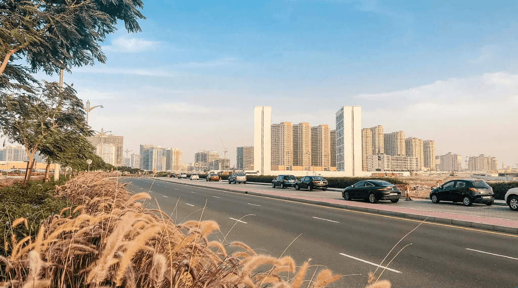 Overview of transportation options in Dubai Production City, featuring roads, public transit, and nearby amenities.