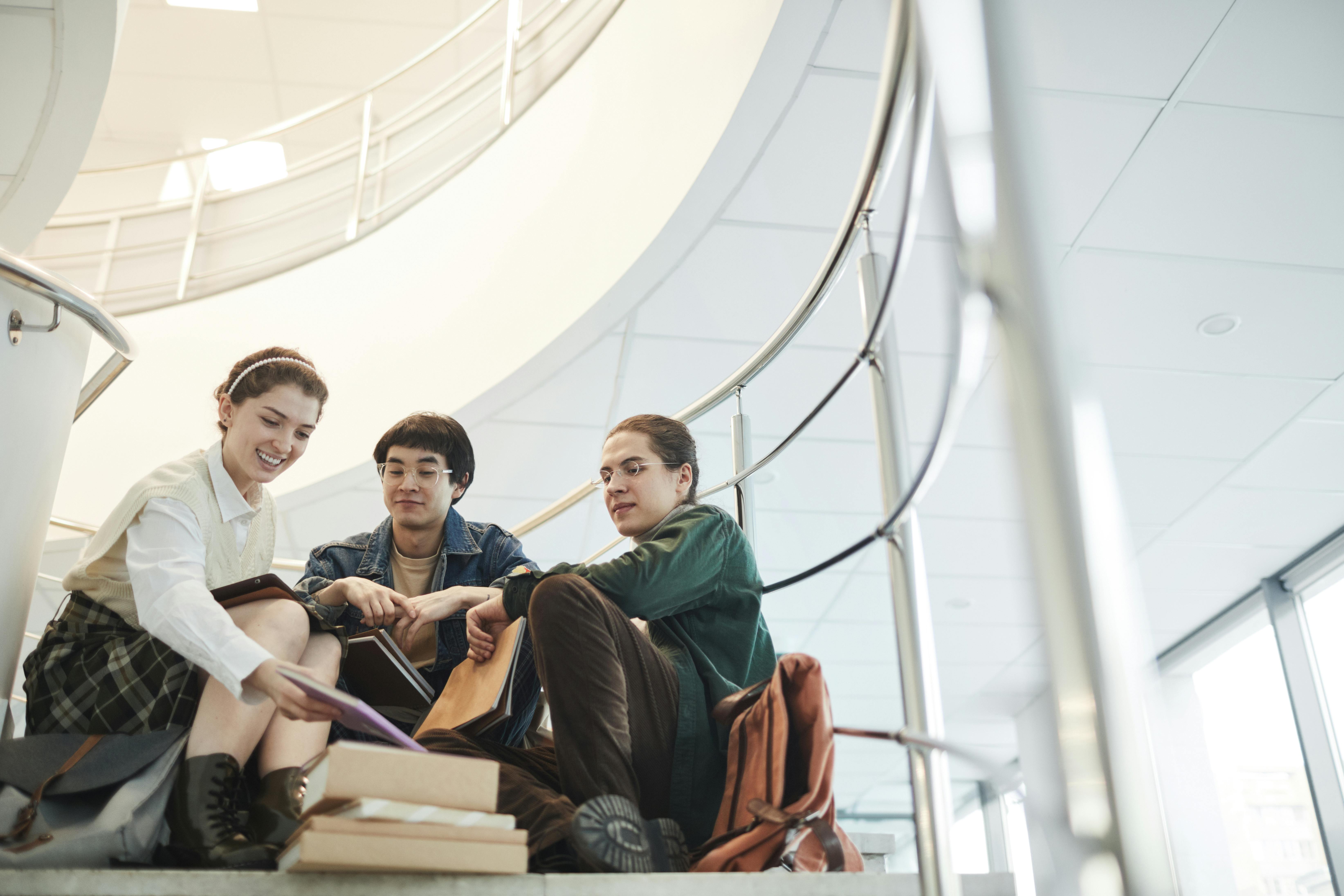 five children smiling while doing peace hand sign