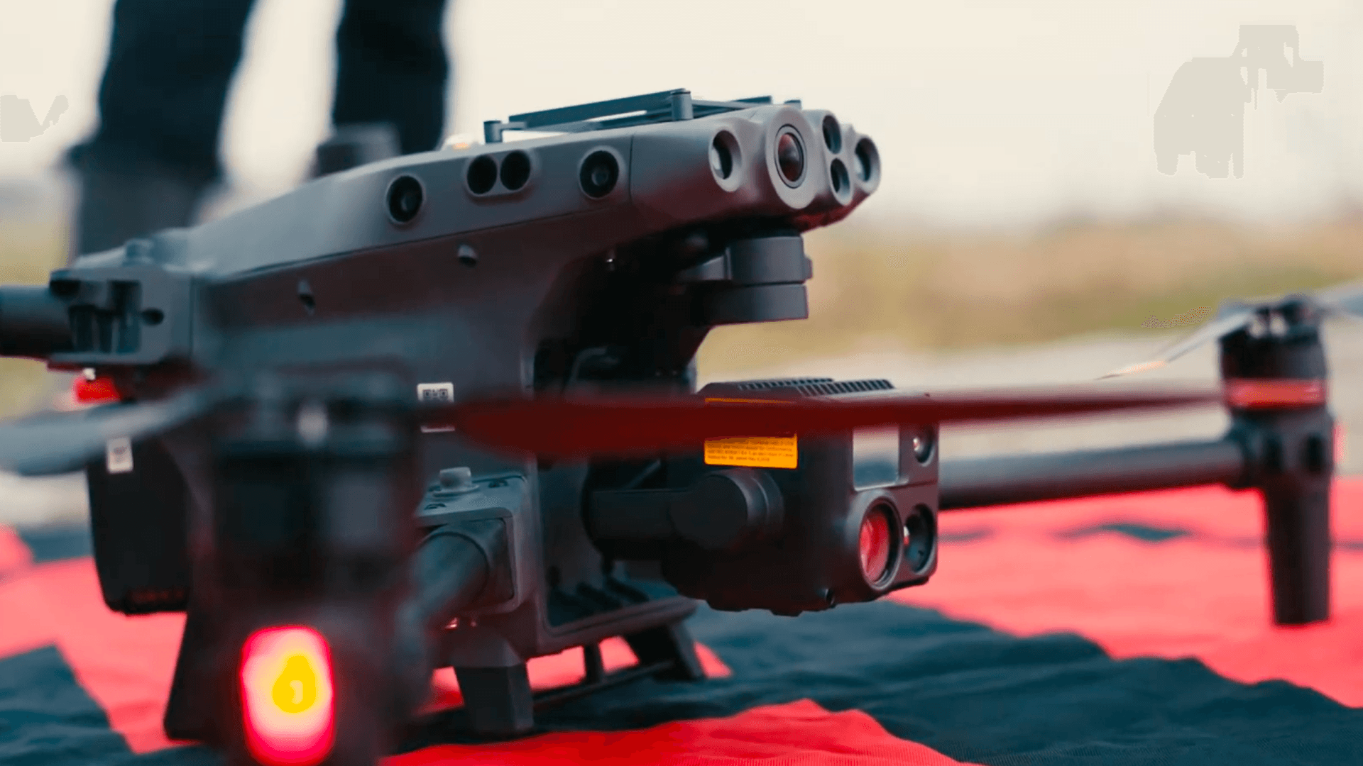 Enterprise drone with multi-sensor payload on a landing pad, ready for fleet deployment