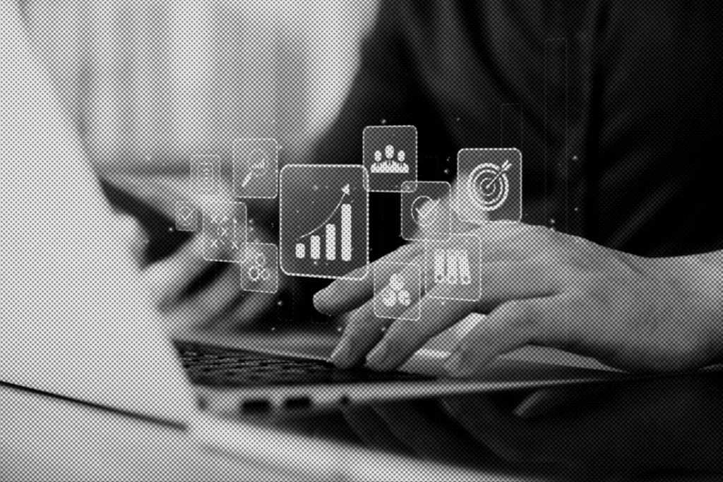 person in red and black plaid long sleeve shirt using black laptop computer